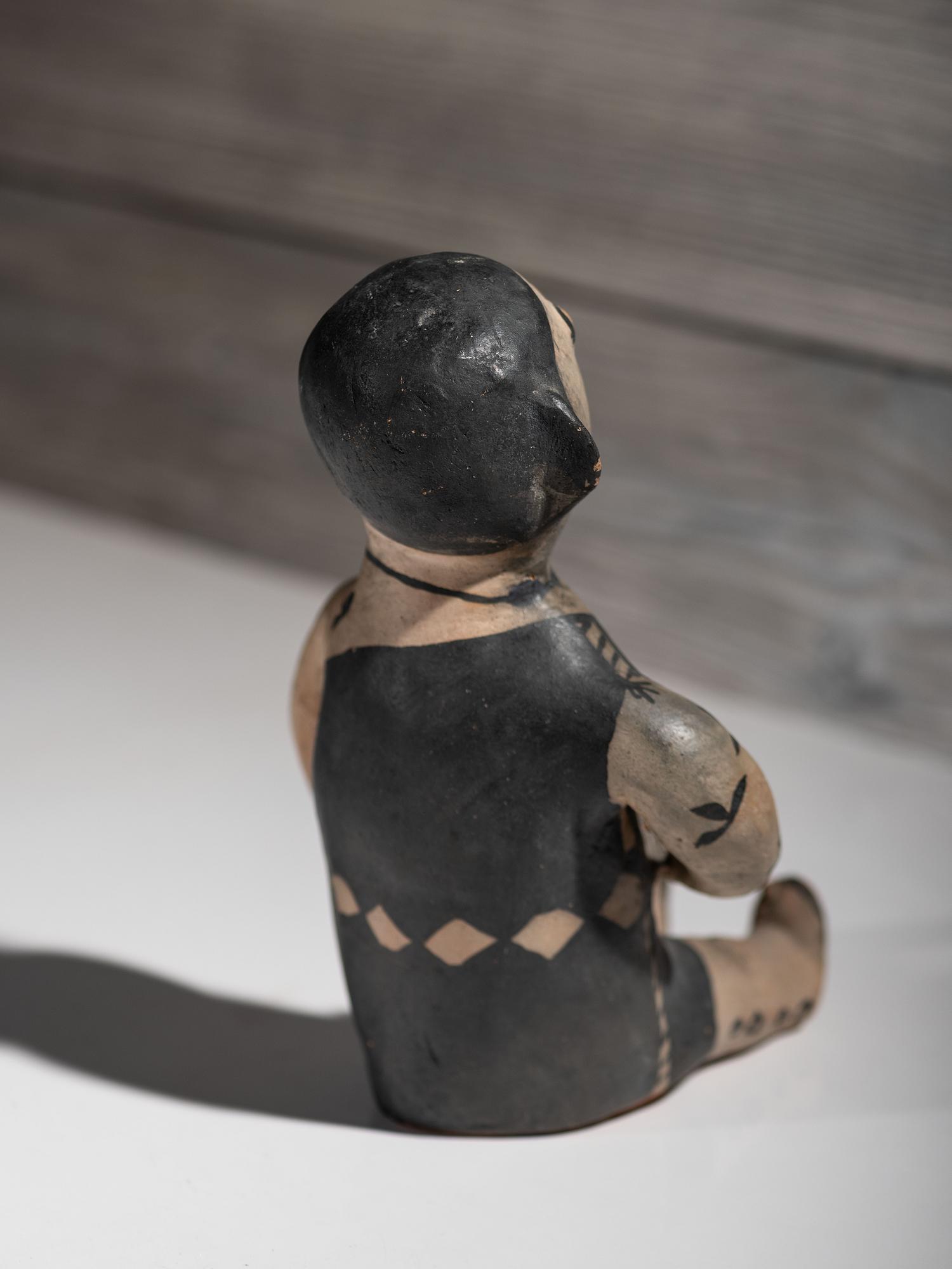 Seated Cochiti Pottery Figure
