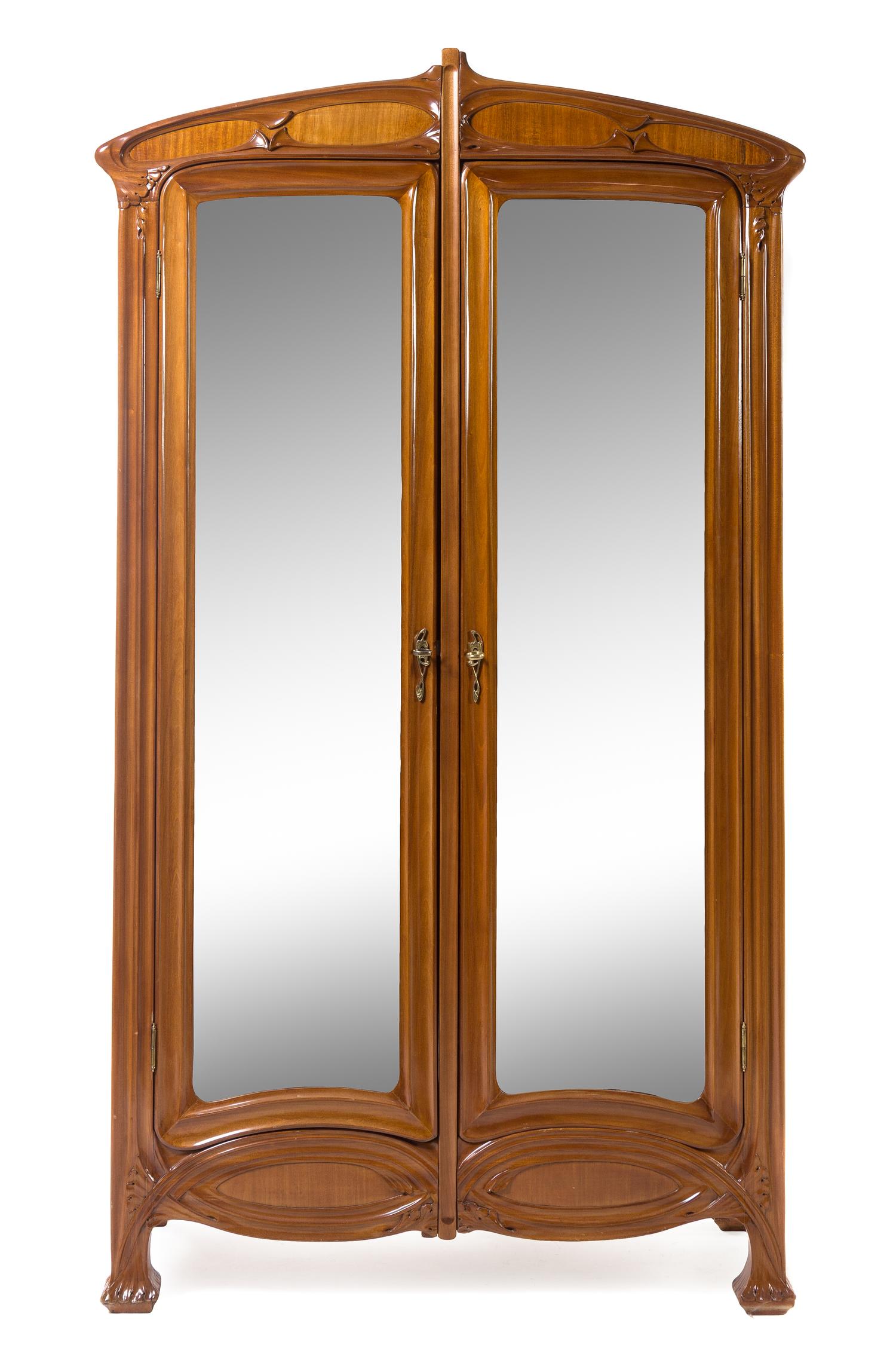Louis Majorelle, (French, 1859-1926), a bedroom set, comprising an armoire separated into two individual display cabinets, two twin hea