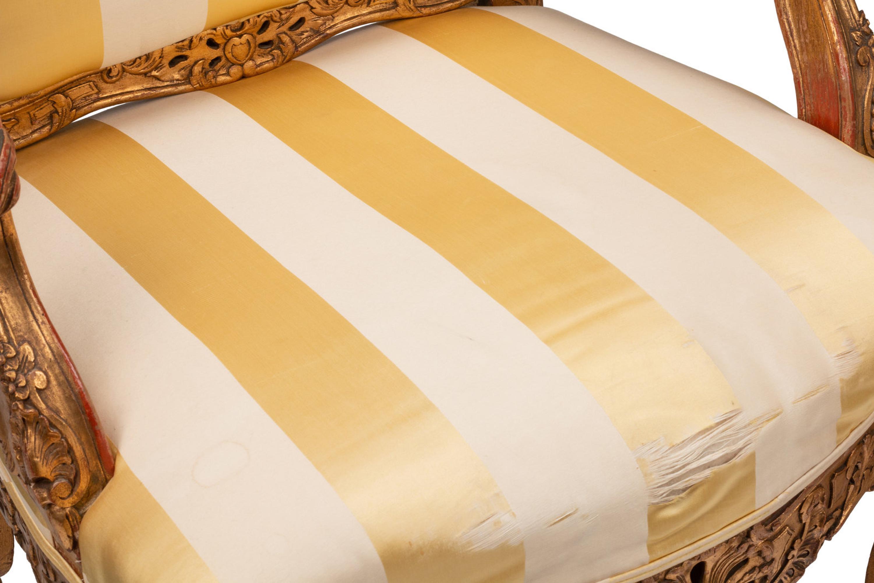 A Pair of Régence Style Giltwood Fauteuils