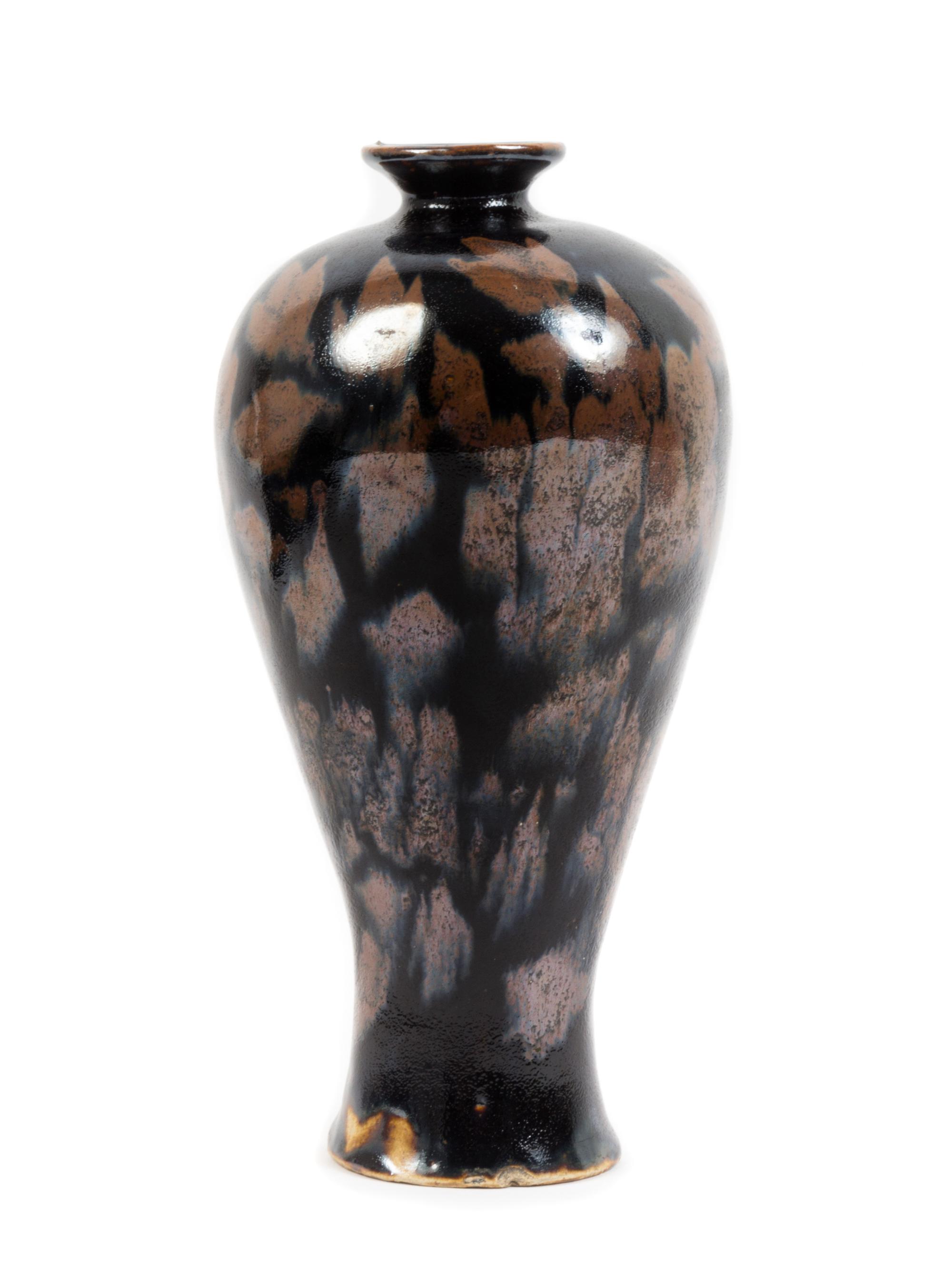 A Jizhou Style Black Glazed Russet Splashed Stoneware Vase Height 9 inches.