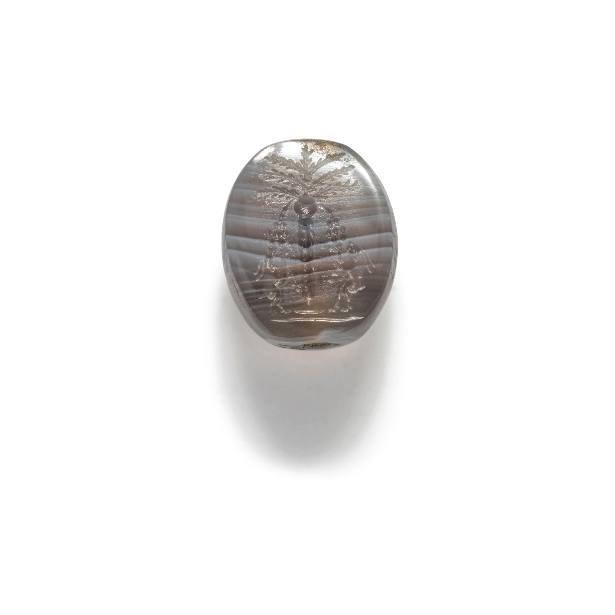 A Levantine Banded Agate Bead with Two Ibexes Feeding on a Date Tree