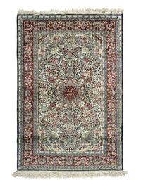 A Silk Tabriz Rug