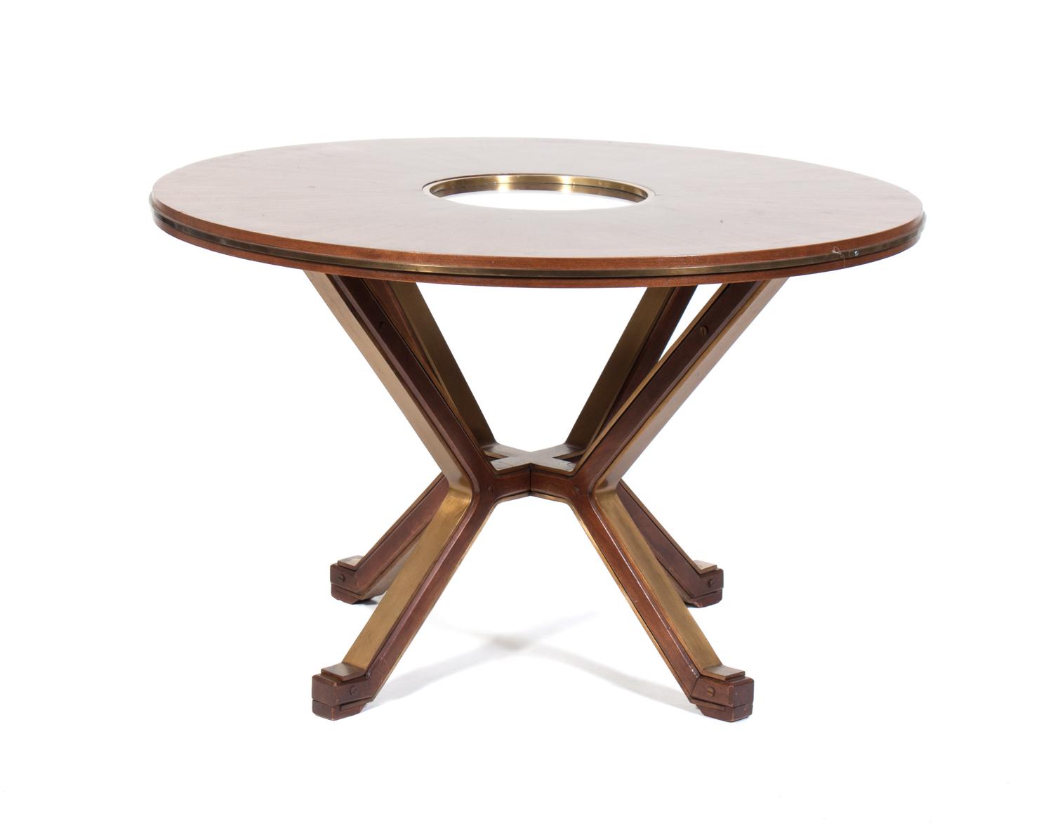 A Dining Table Diameter 47 1/2 inches. — ATTRIBUTED TO FONTANA ARTE, CIRCA 1950