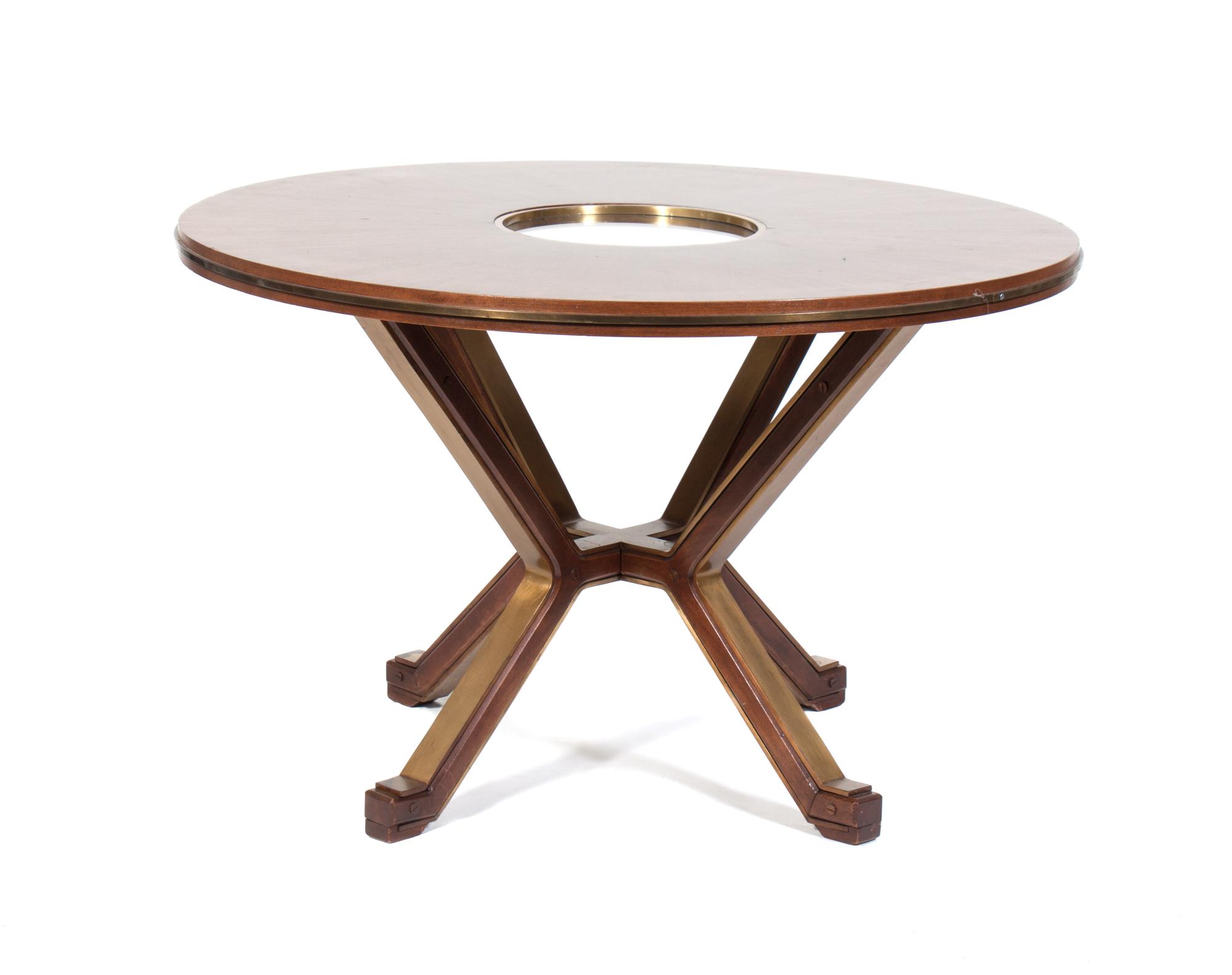 A Dining Table Diameter 47 1/2 inches. — ATTRIBUTED TO FONTANA ARTE, CIRCA 1950