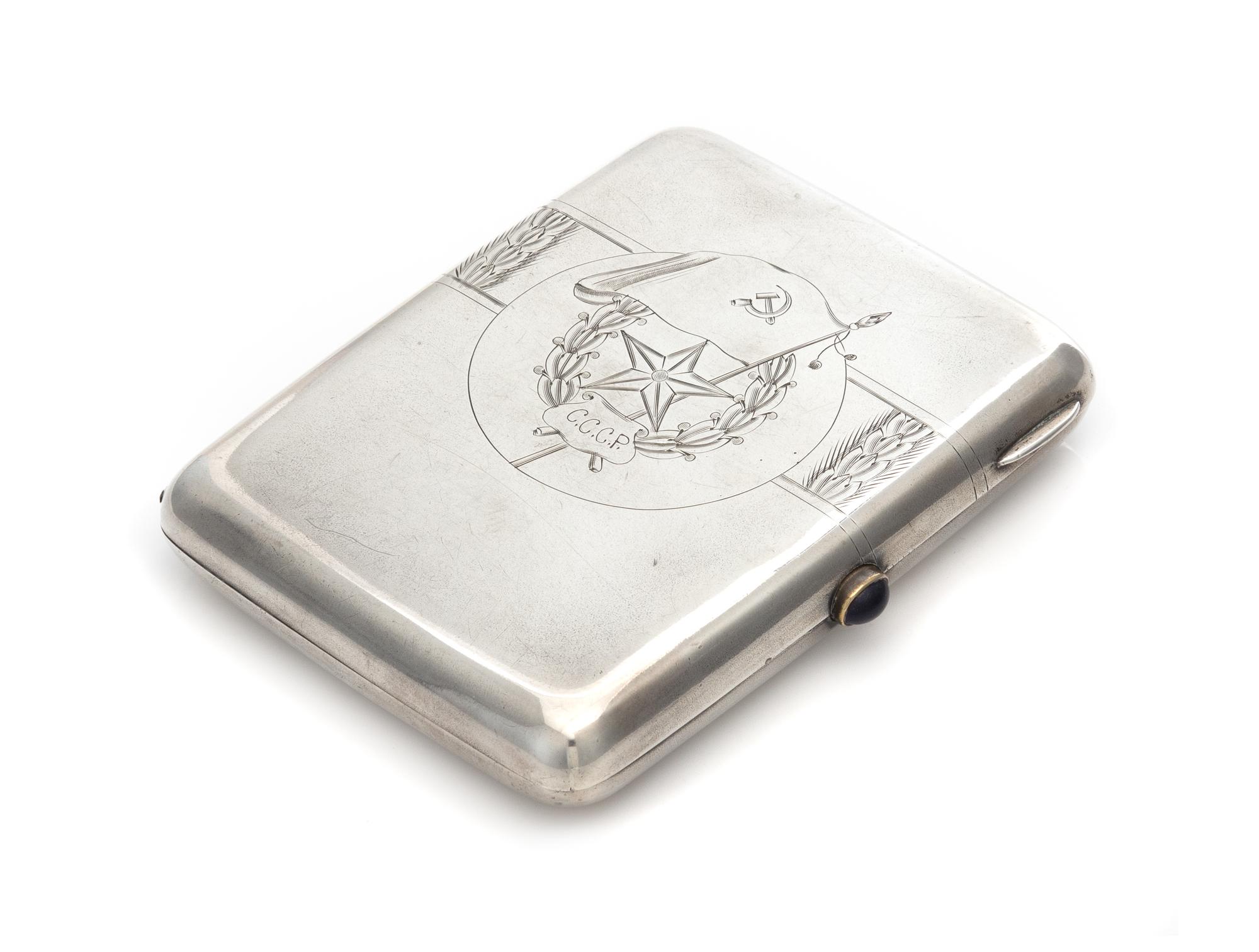 A Soviet-Era Russian Silver Cigarette Case, Maker's Mark Obscured, Moscow, Mid-20th Century, the lid engraved to show symbols of the So
