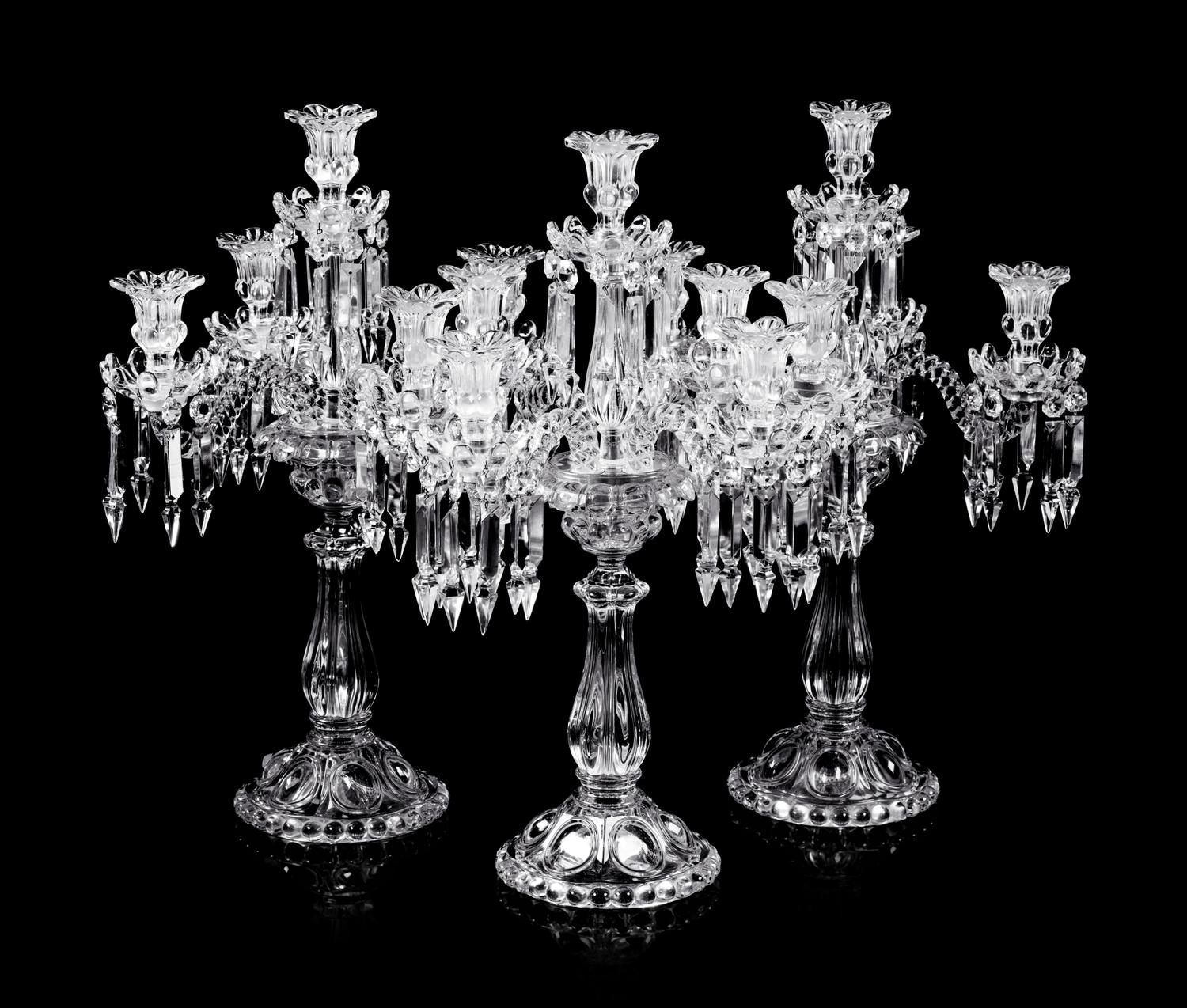 A Set of Three Baccarat Molded Glass Five-Light Candelabra
