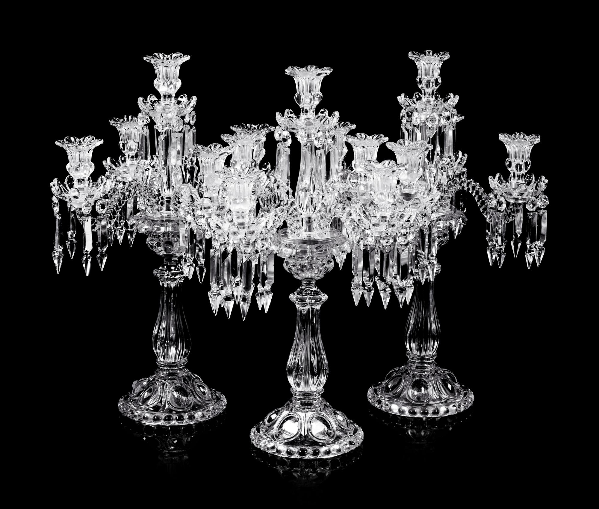 A Set of Three Baccarat Molded Glass Five-Light Candelabra
