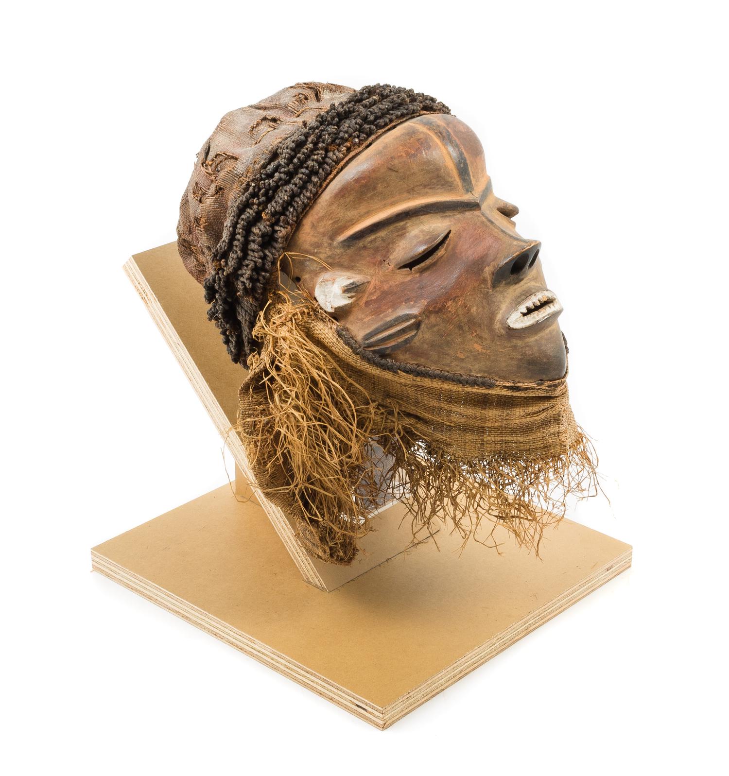 A Pende Wood and Raffia Initiation Ceremony Mask Height 13 3/4 inches. — CONGO, 19TH/20TH CENTURY