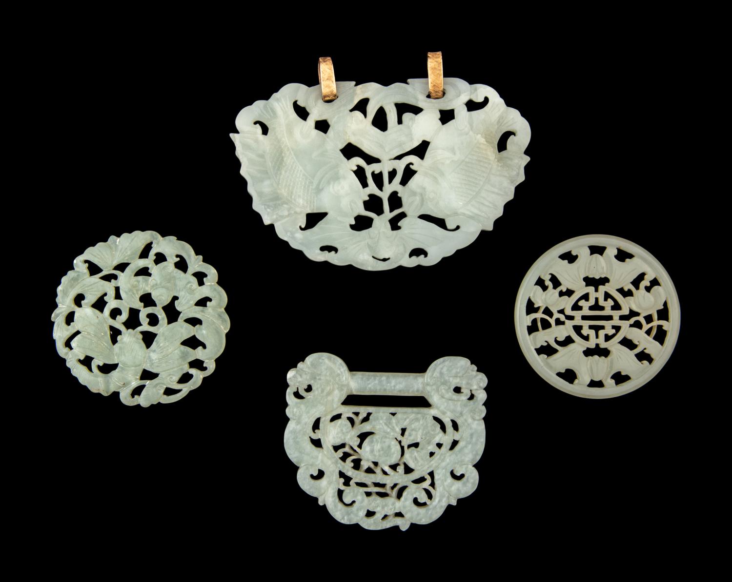 Four Chinese Reticulated Jade and Serpentine Pendants