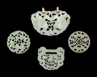 Four Chinese Reticulated Jade and Serpentine Pendants