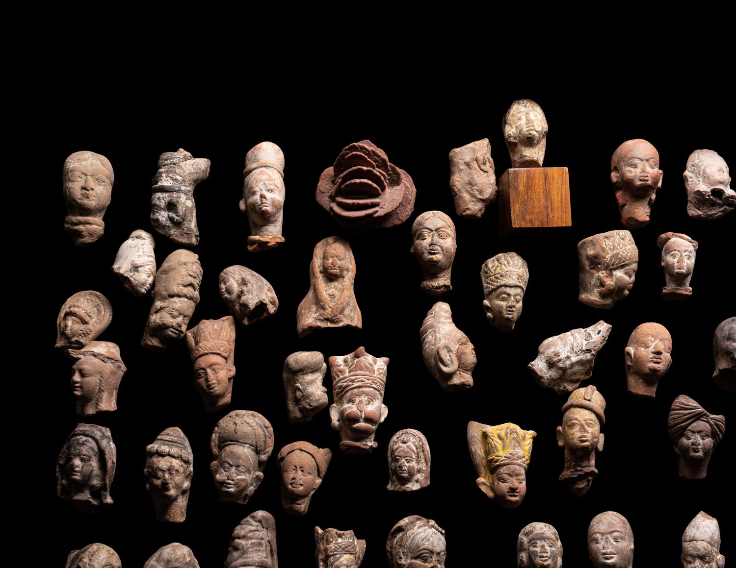 A Group of 65 Gandharan Terracotta Heads