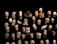 A Group of 65 Gandharan Terracotta Heads