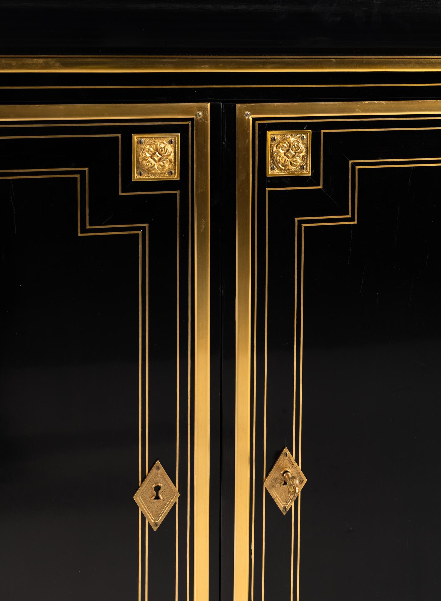 A Pair of Custom Gilt Bronze Mounted Ebonized Cabinets