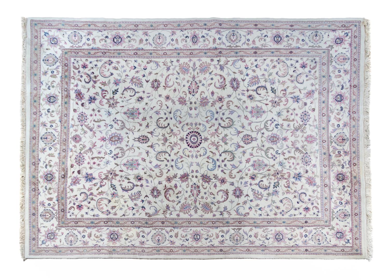 A Tabriz Wool Rug 13 feet 10 inches x 9 feet 10 inches.