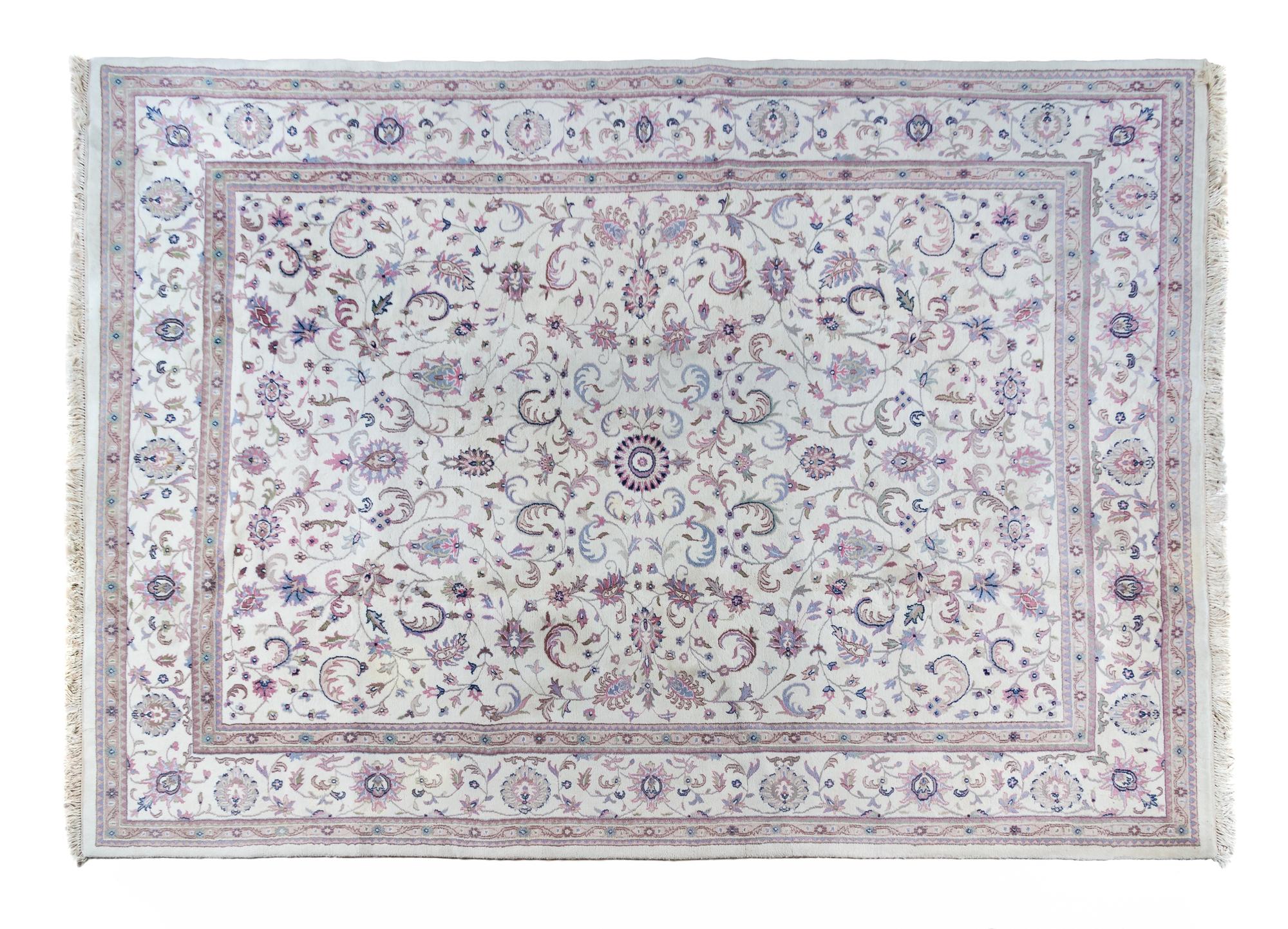 A Tabriz Wool Rug 13 feet 10 inches x 9 feet 10 inches.