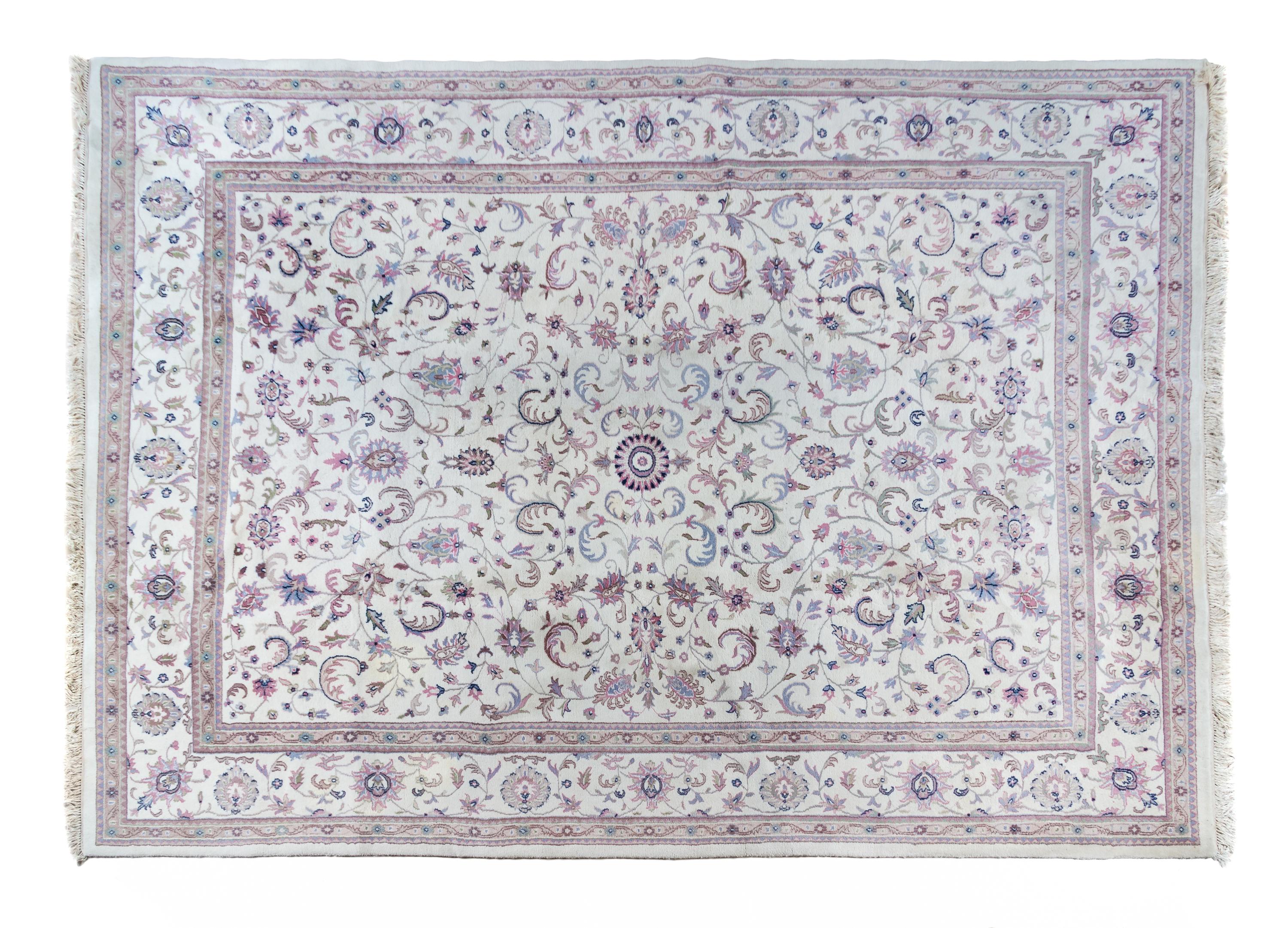 A Tabriz Wool Rug 13 feet 10 inches x 9 feet 10 inches.