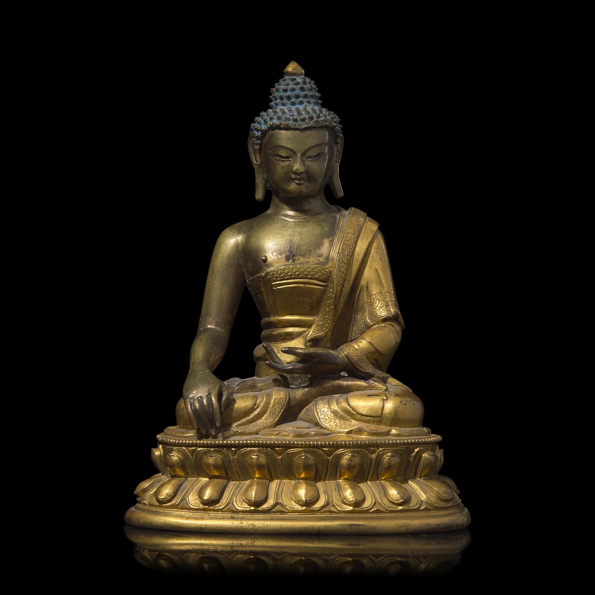 A Sino-Tibetan Gilt Bronze Figure of a Buddha, Qing Dynasty, Probably 18th Century 或十八世紀 鎏金銅佛坐像