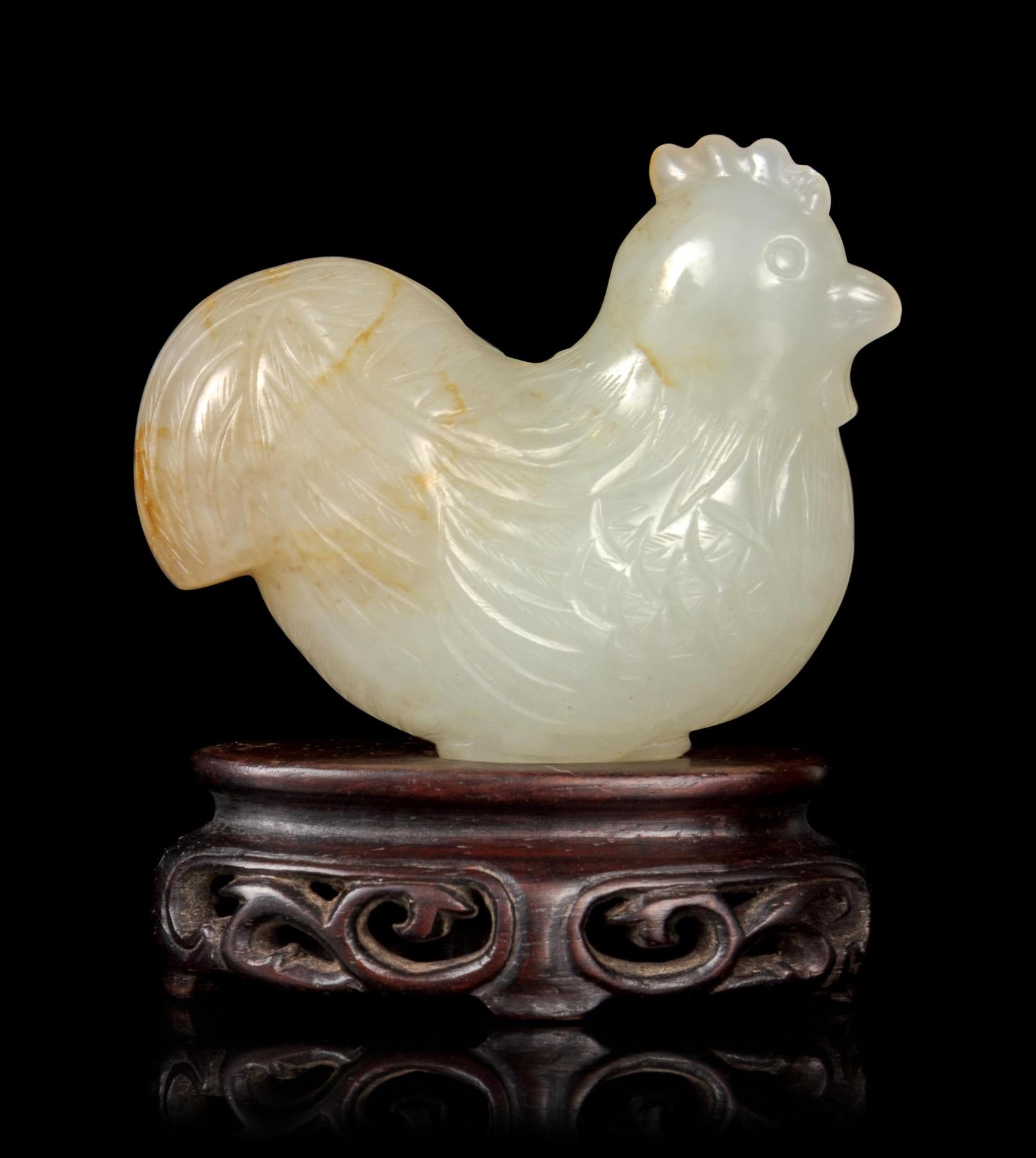 A Carved Pale Celadon and Russet Jade Figure of Rooster