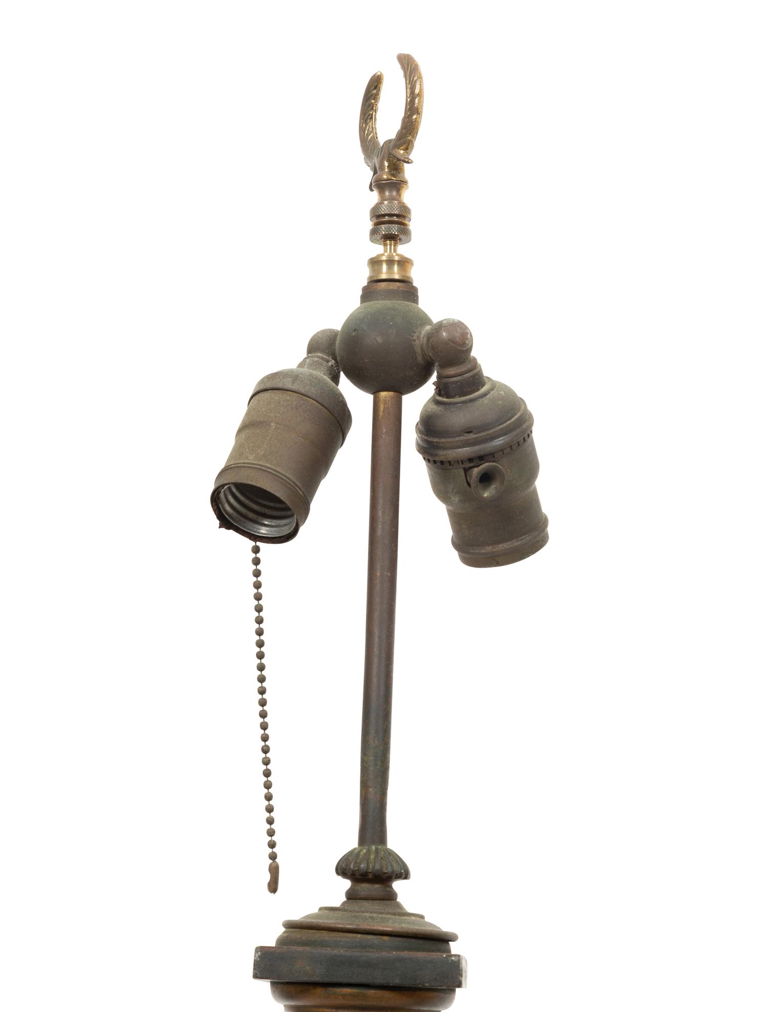 A Pair of Regency Style Ebonized and Gilt Tole Table Lamps