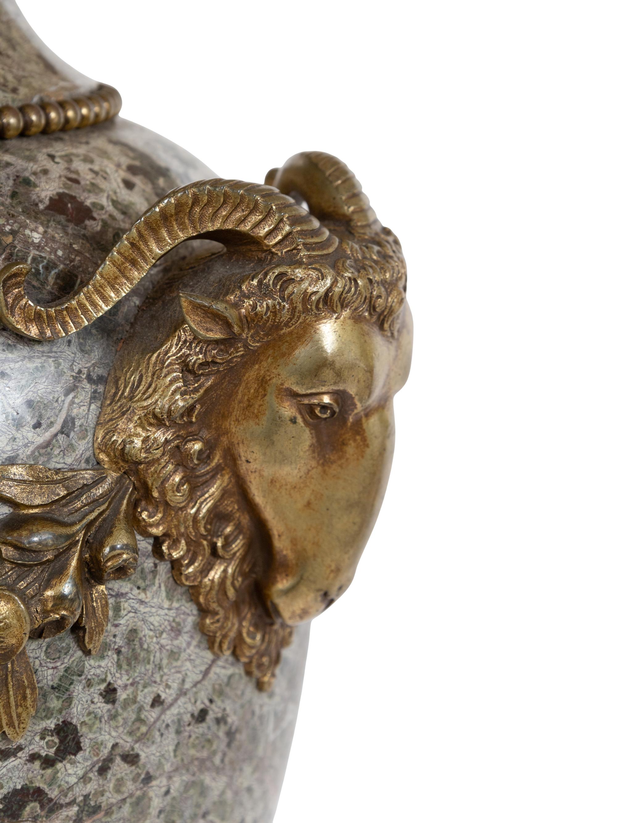 A Pair of French Marble and Gilt Bronze Mounted Urns