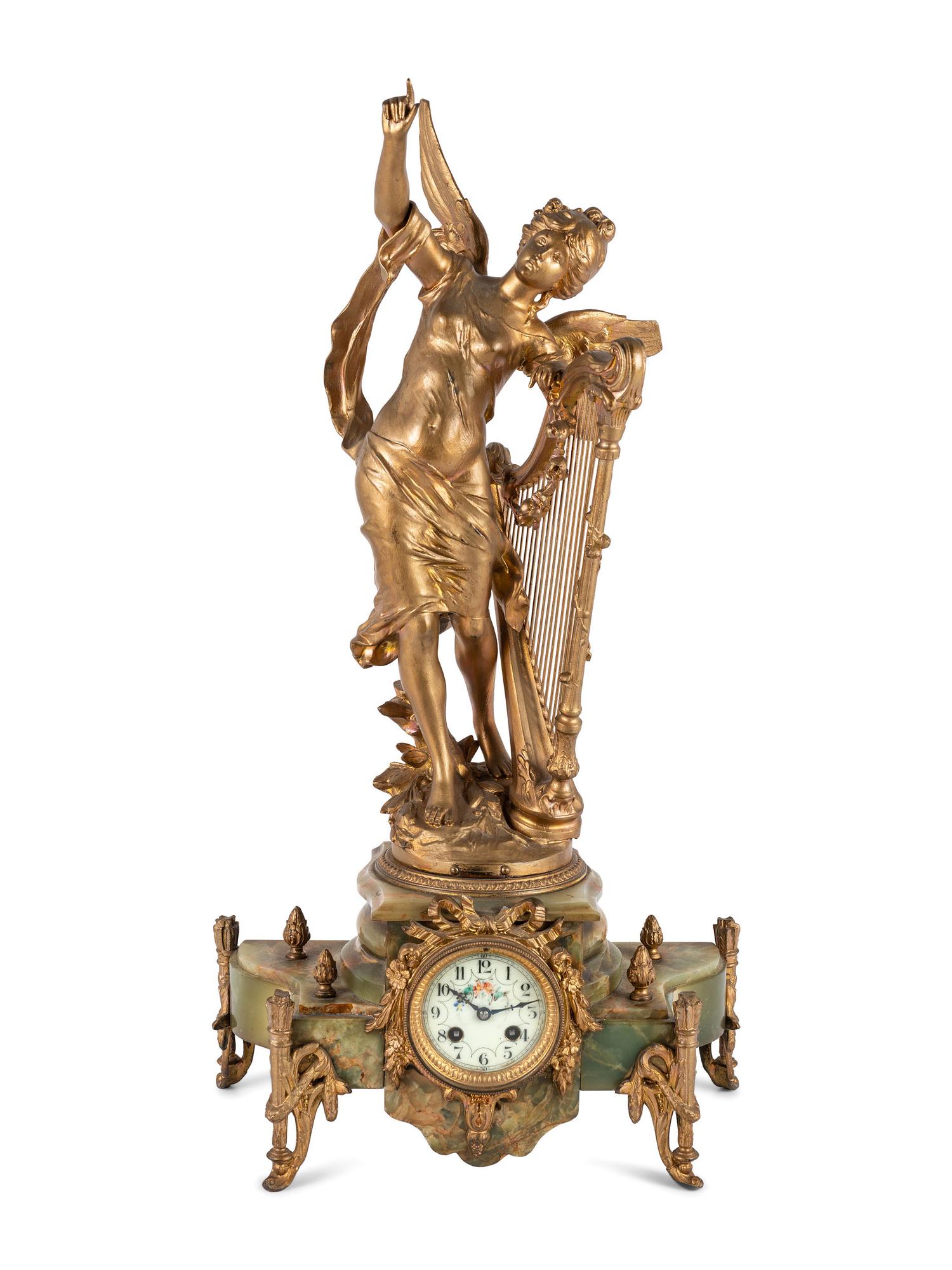 A Neoclassical Gilt Metal and Onyx Clock Garniture
