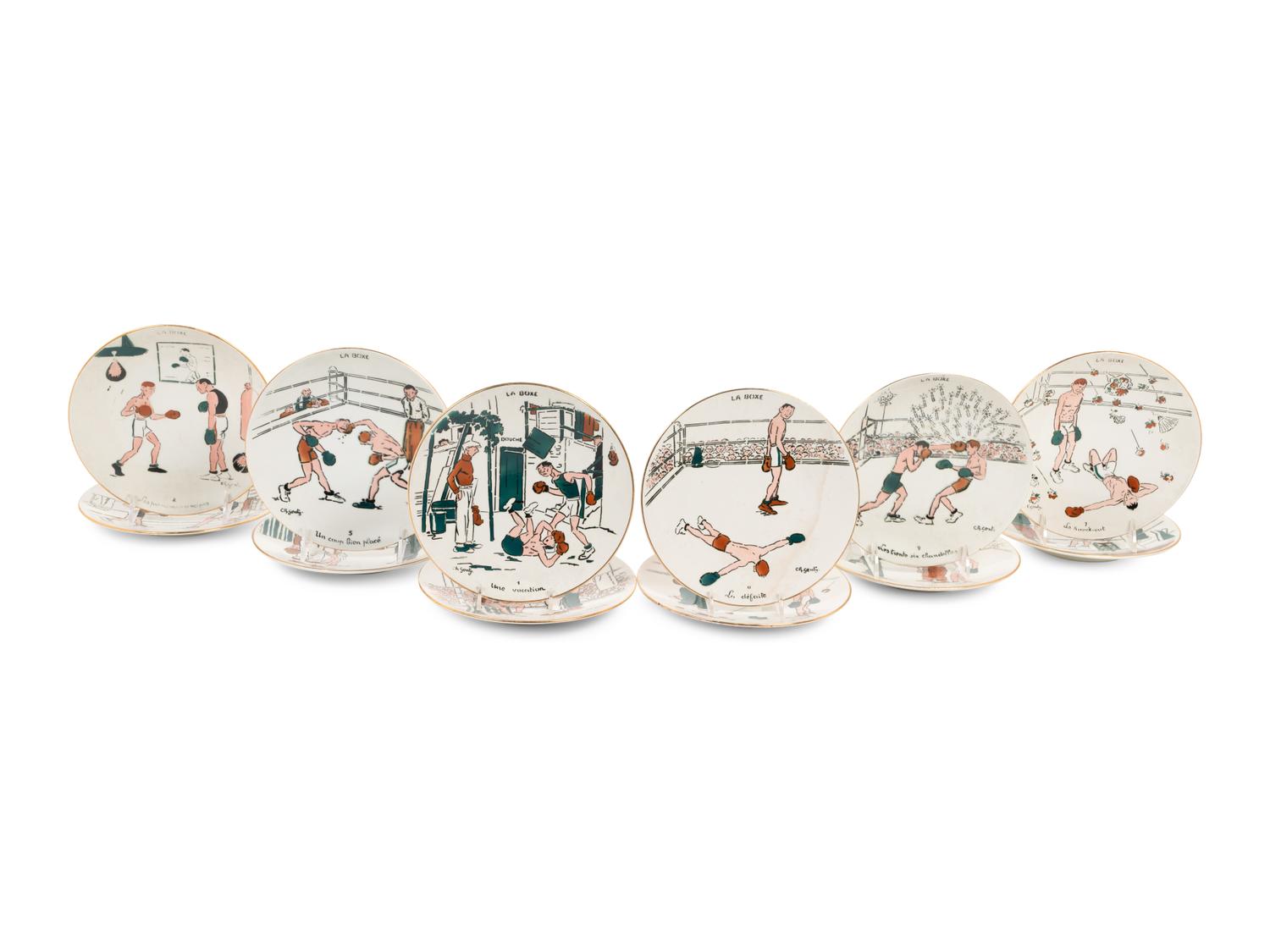 A Set of Twelve Le Boxe Decorative Plates Featuring Boxing Scenes by C. R. Genty,