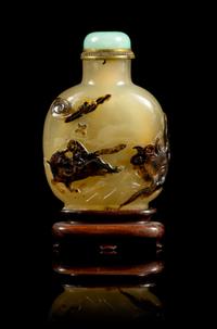 A Carved Agate Snuff Bottle Height 3 inches.