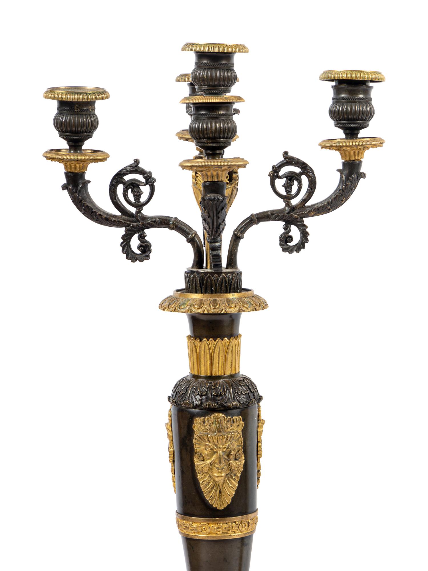 A Pair of Louis Philippe Gilt and Patinated Bronze Five-Light Candelabra