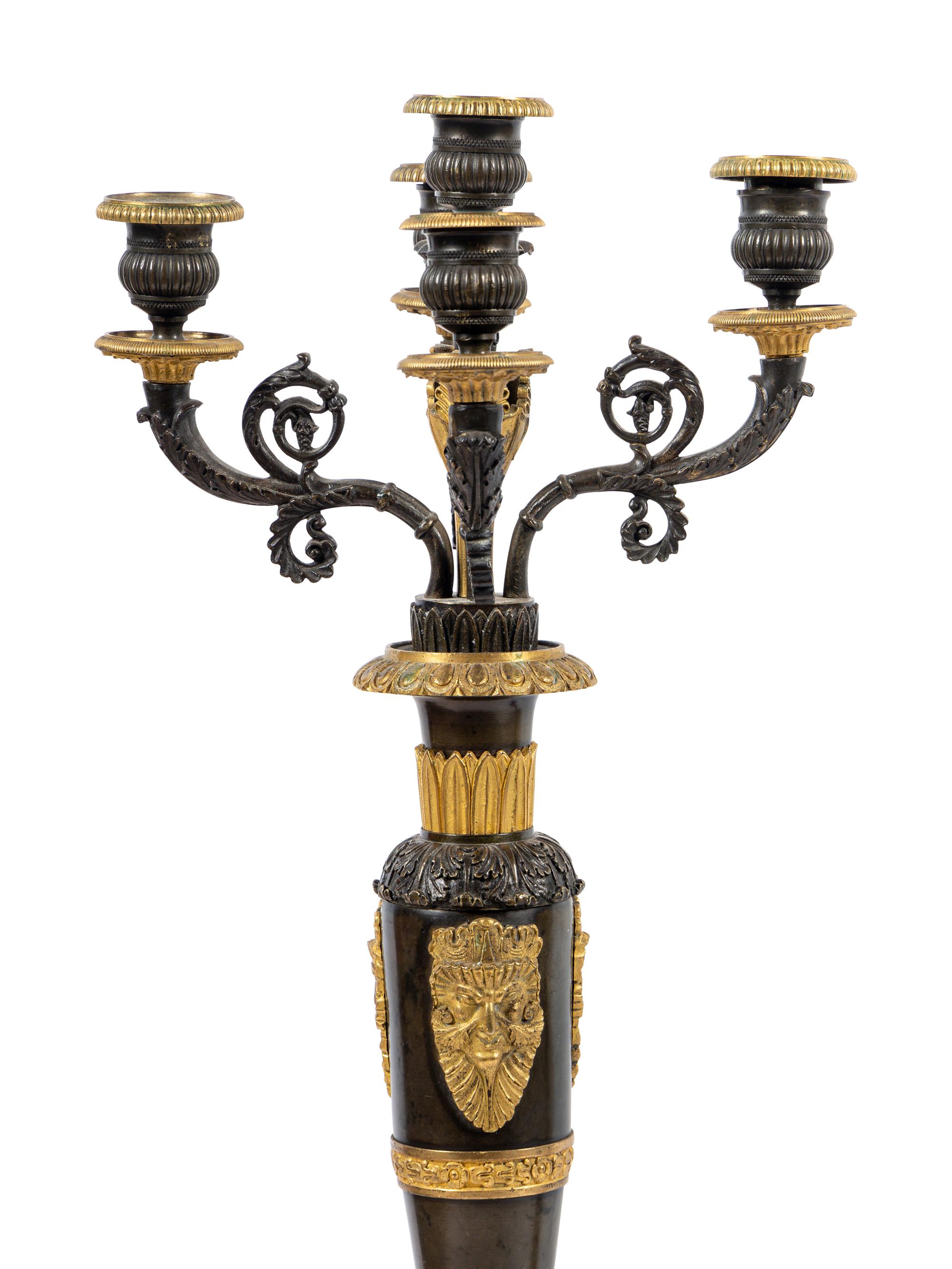 A Pair of Louis Philippe Gilt and Patinated Bronze Five-Light Candelabra