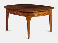 An Austrian Secessionist Inlaid Dining Suite, comprising a sideboard, a server, an extension dining table with five leaves, six side chairs and four armchairs