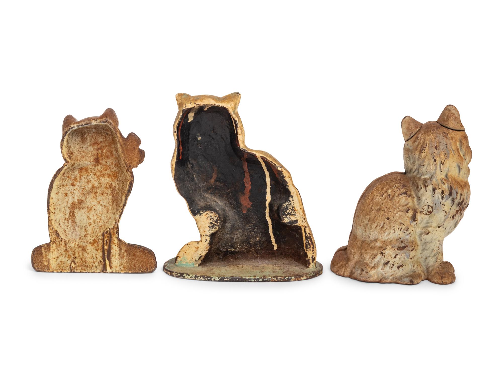 A Group of Three Painted-Iron Cat Form Door Stops