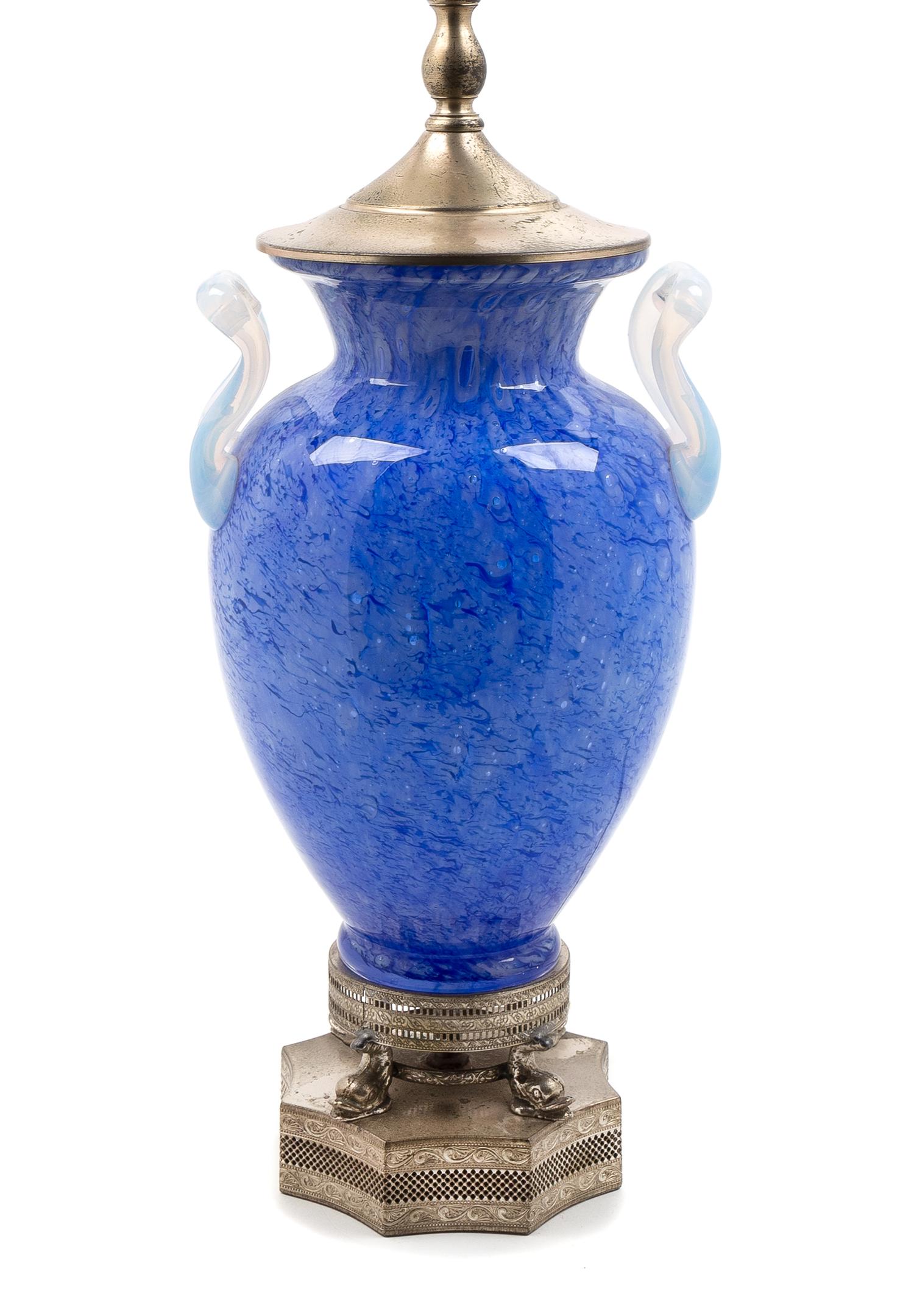 Steuben, FIRST HALF 20TH CENTURY, a blue Cluthra glass lamp, with opaline handles.