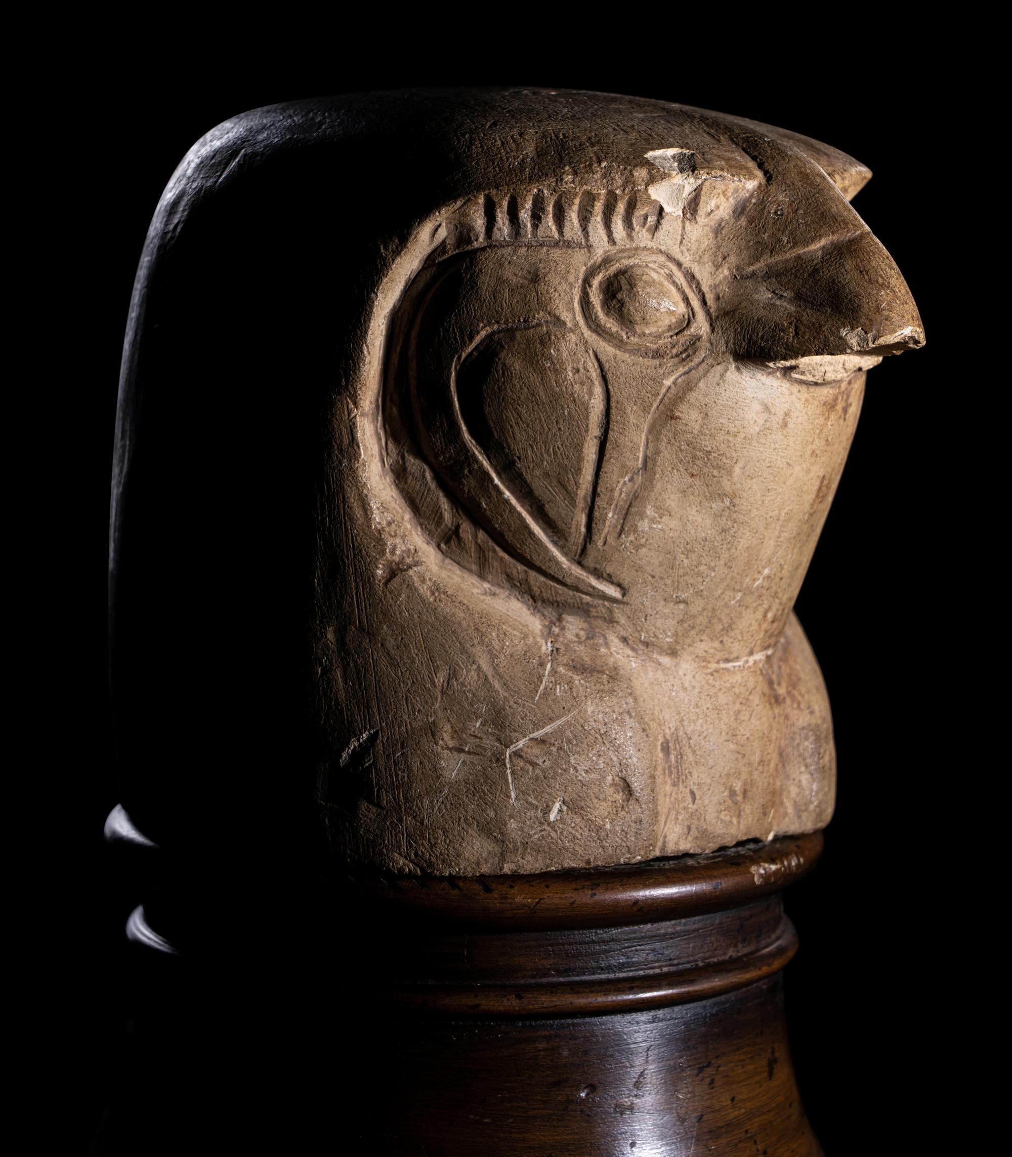 An Egyptian Limestone Canopic Jar Lid in the Form of Qebhsenuef
