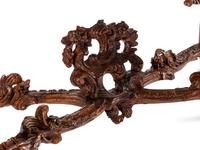 An Italian Rococo Carved Walnut Marble-Top Console Table