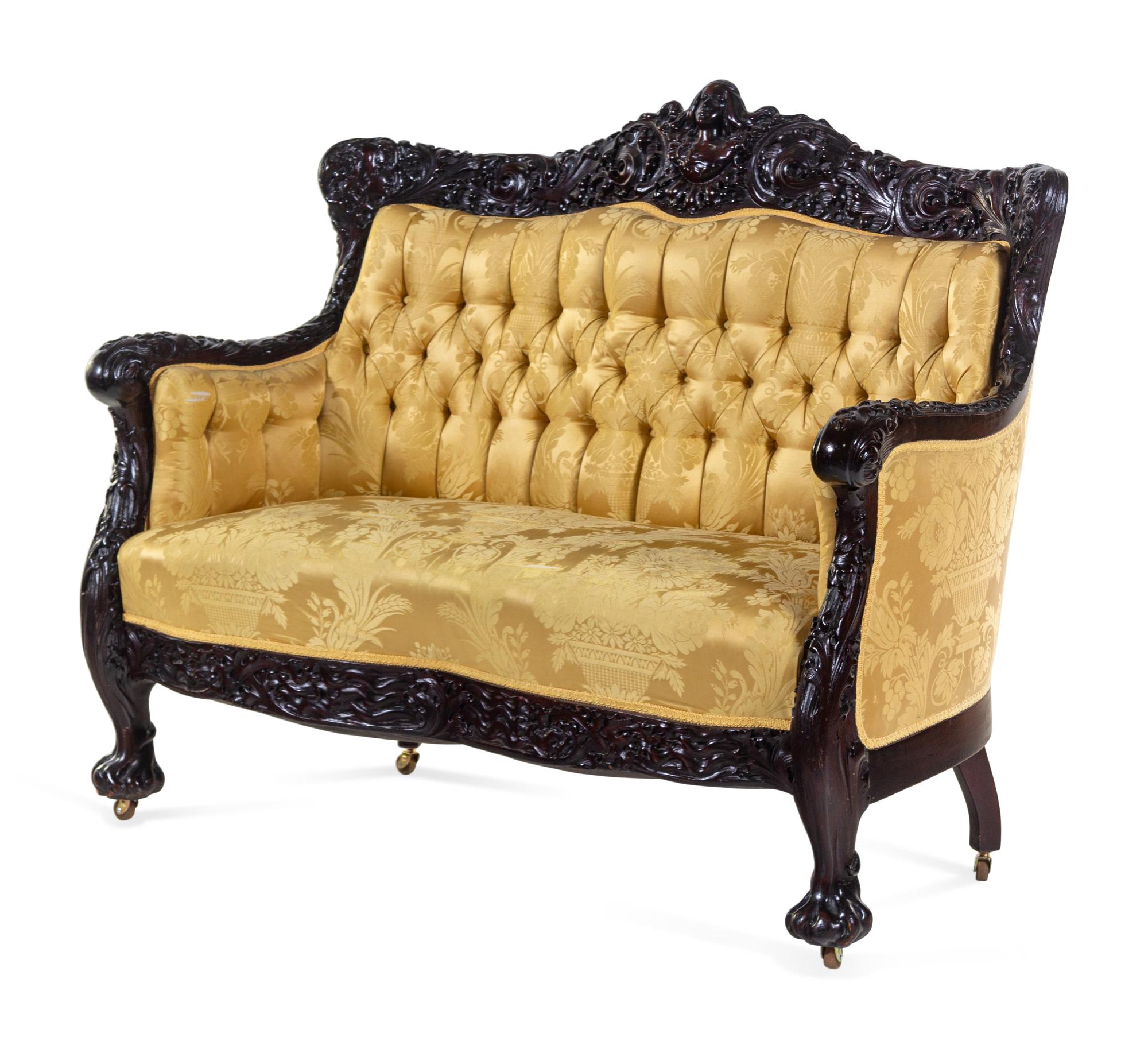 A Karpen Carved Mahogany Three-Piece Parlor Suite