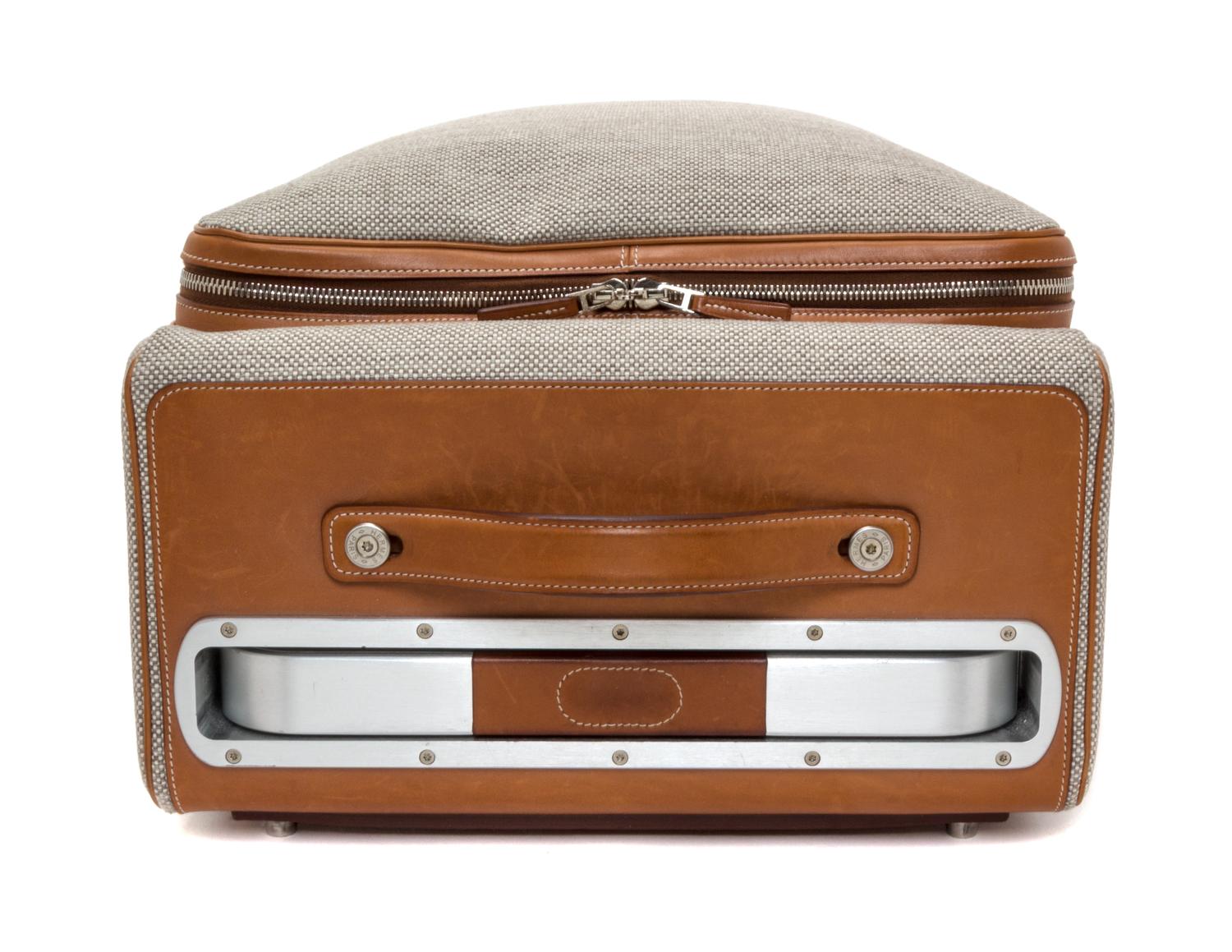 An Hermes Ecru Canvas and Fawn Barenia Calfskin Caleche-Express Suitcase, 14" x 21.5" x 10".