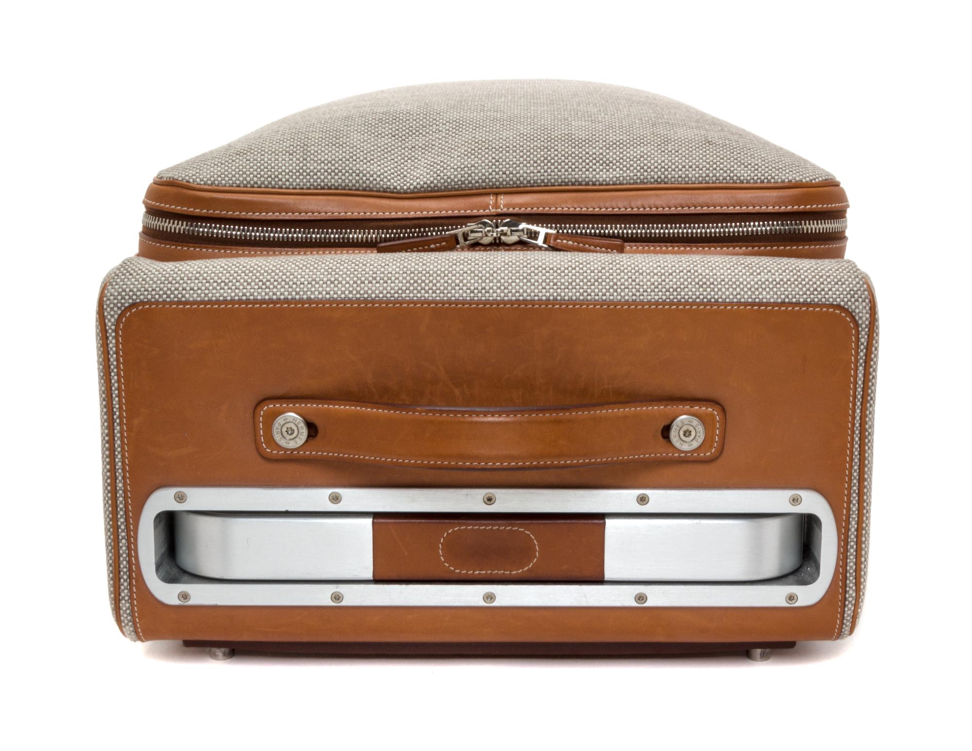An Hermes Ecru Canvas and Fawn Barenia Calfskin Caleche-Express Suitcase, 14" x 21.5" x 10".