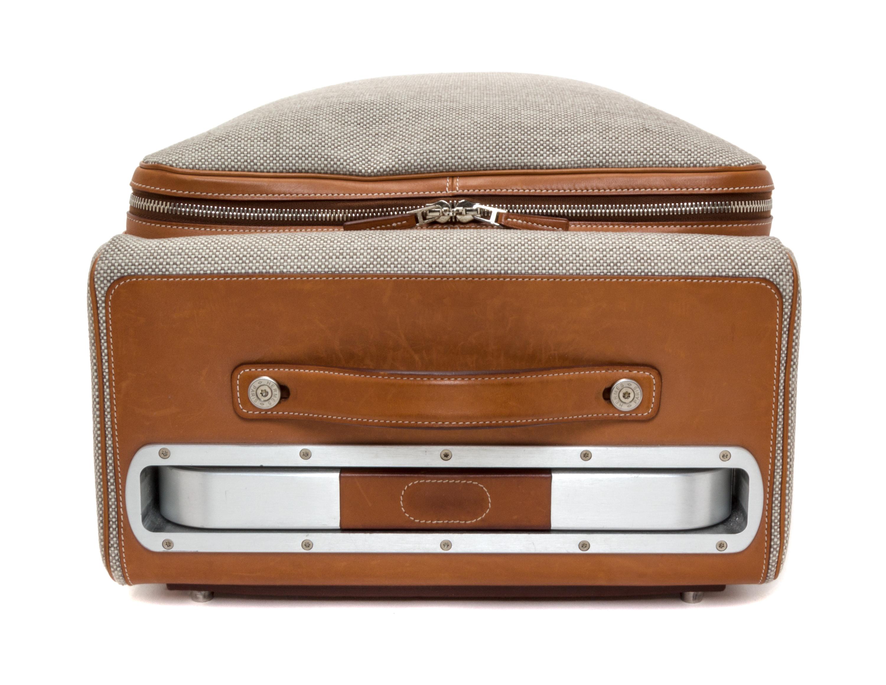 An Hermes Ecru Canvas and Fawn Barenia Calfskin Caleche-Express Suitcase, 14" x 21.5" x 10".