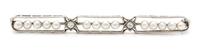 An Art Deco Platinum, Diamond and Seed Pearl Bar Brooch. 3.80 dwts.