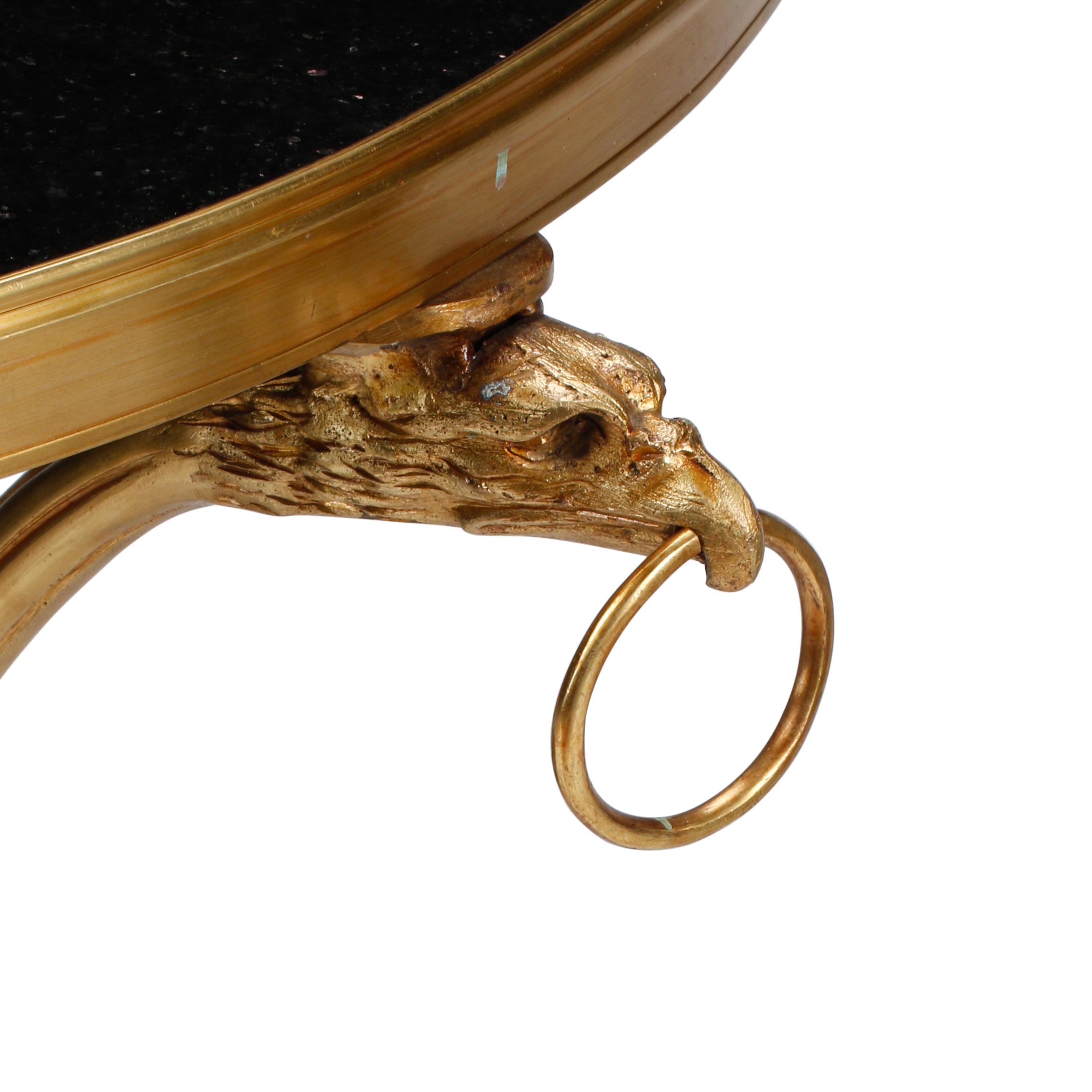 A Pair of Empire Style Gilt Bronze and Black Granite Guéridons