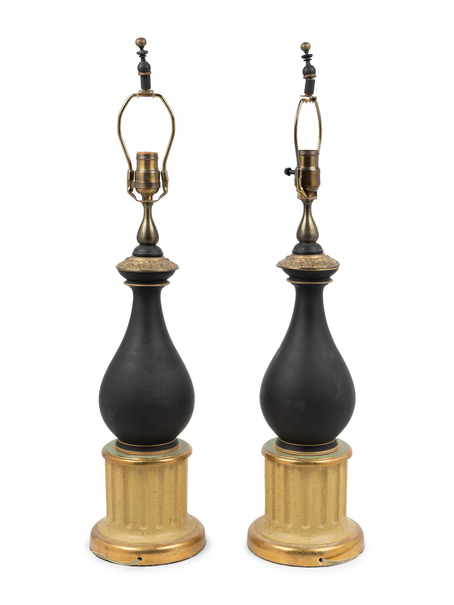 A Pair of Continental Porcelain and Giltwood Lamps