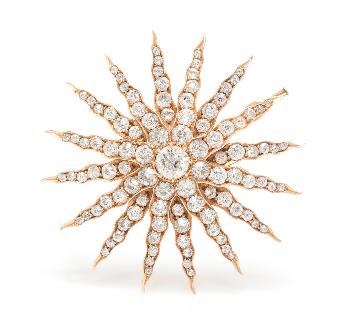 A Yellow Gold and Diamond Starburst Pendant/Brooch, 9.00 dwts.