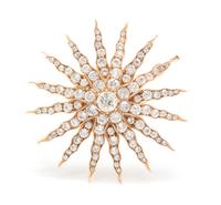 A Yellow Gold and Diamond Starburst Pendant/Brooch, 9.00 dwts.