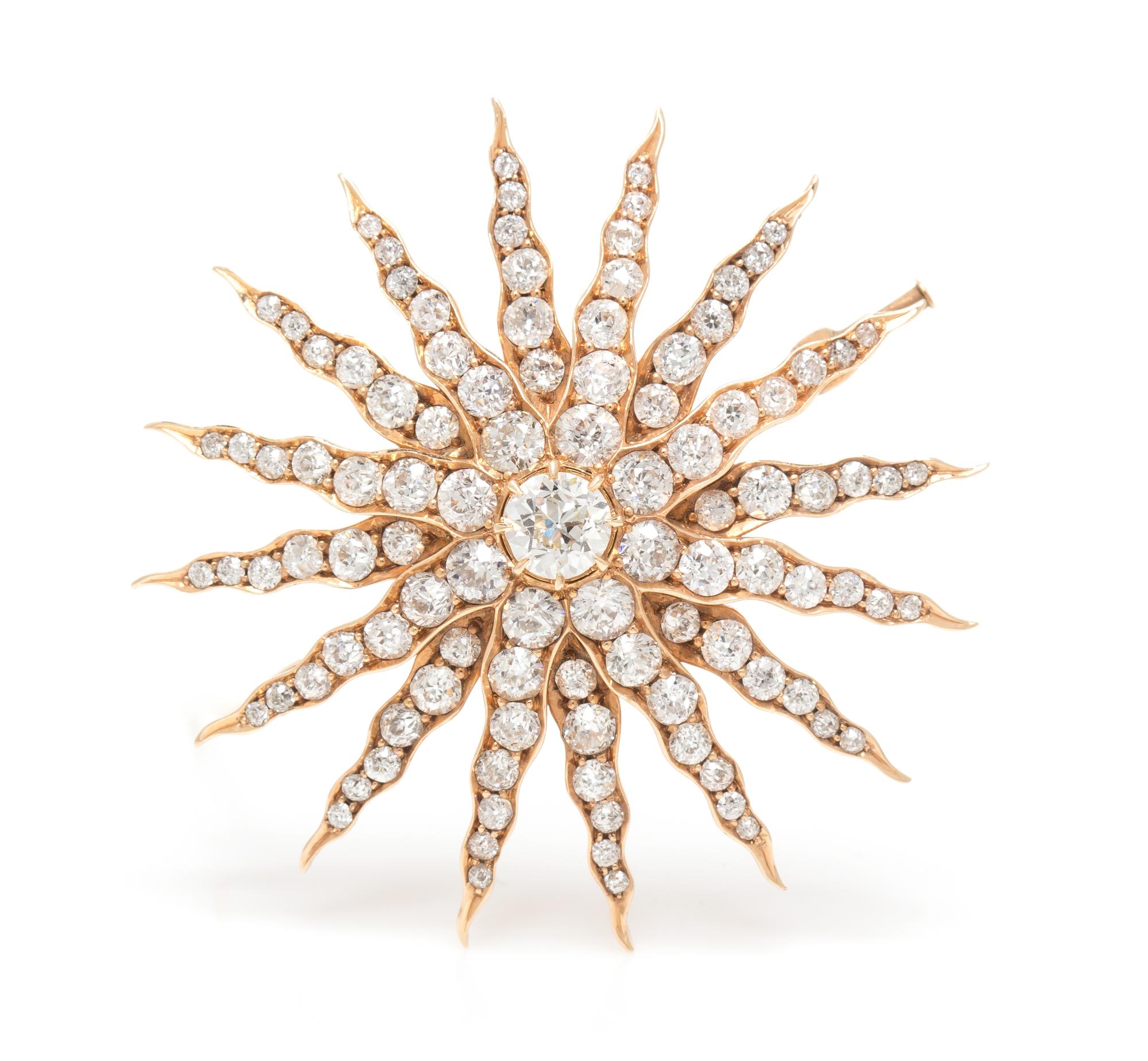 A Yellow Gold and Diamond Starburst Pendant/Brooch, 9.00 dwts.
