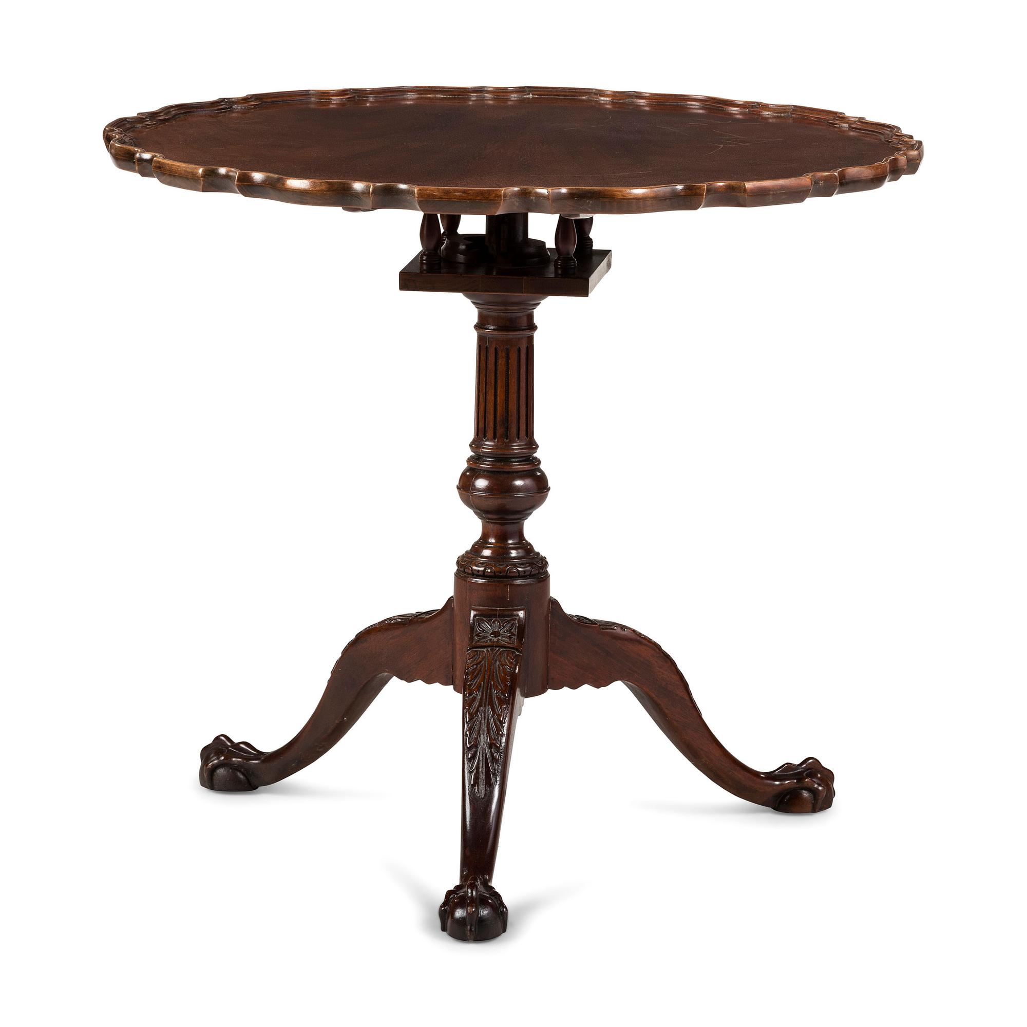 A Chippendale Style Carved Mahogany Pie-Crust Tilt-Top Tea Table