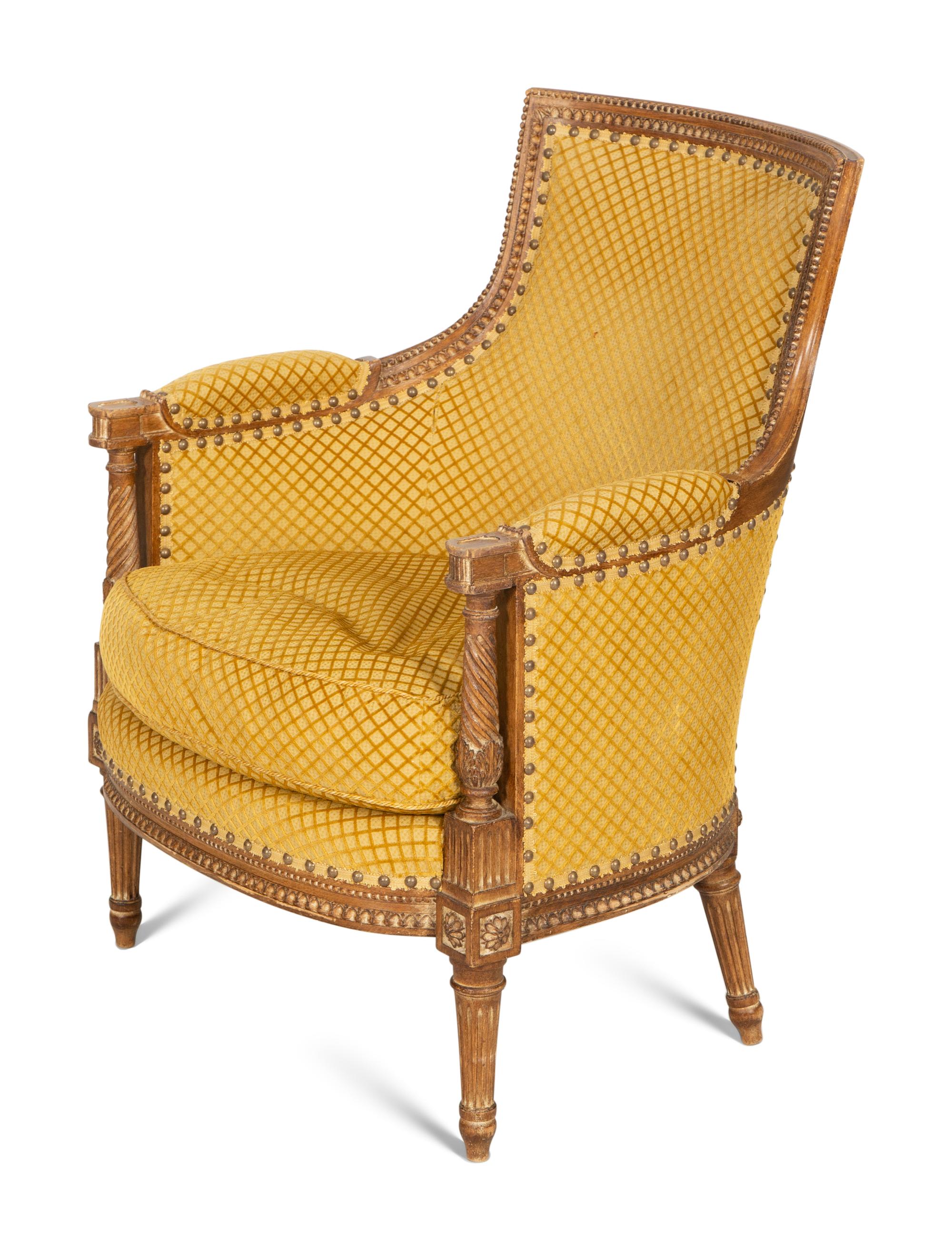 A Louis XVI Style Carved Beech Bergère