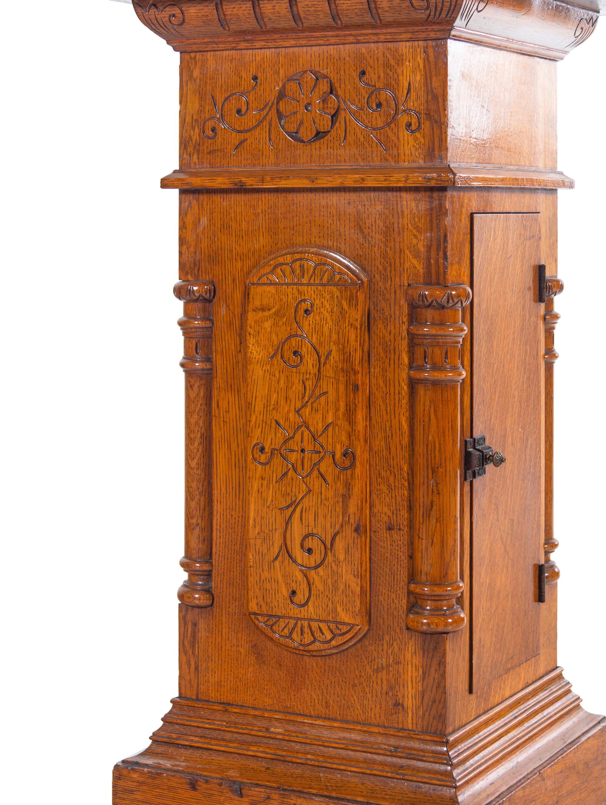 An Aesthetic Movement Carved Oak Pedestal