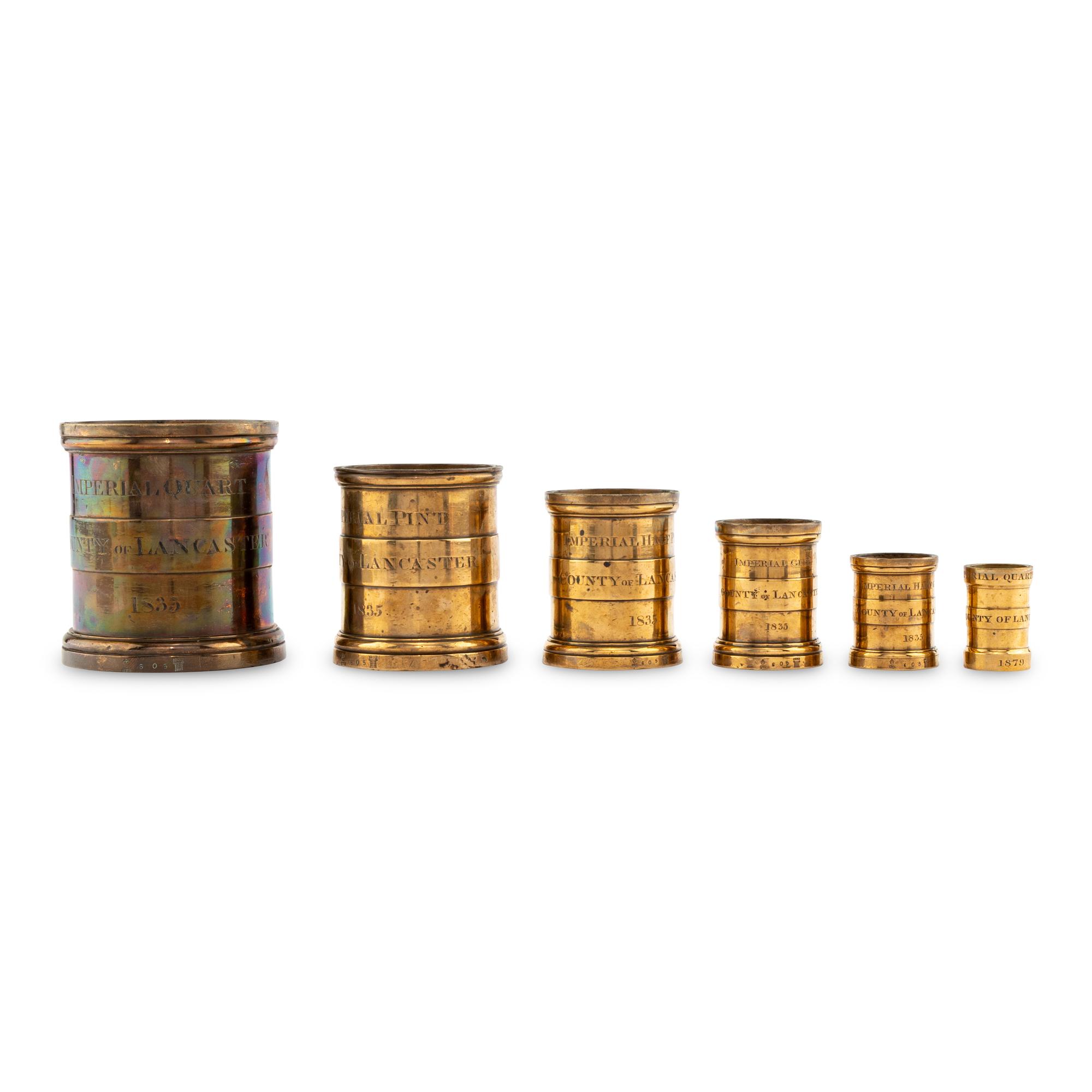 An Assembled Set of Nine English Brass Imperial Standard Grain Measures