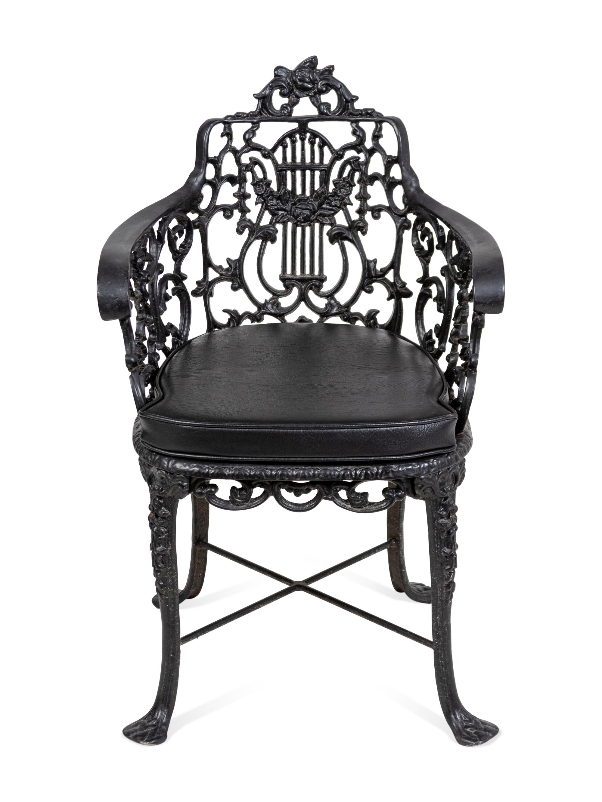 A Suite of Black Painted Metal Garden Furniture