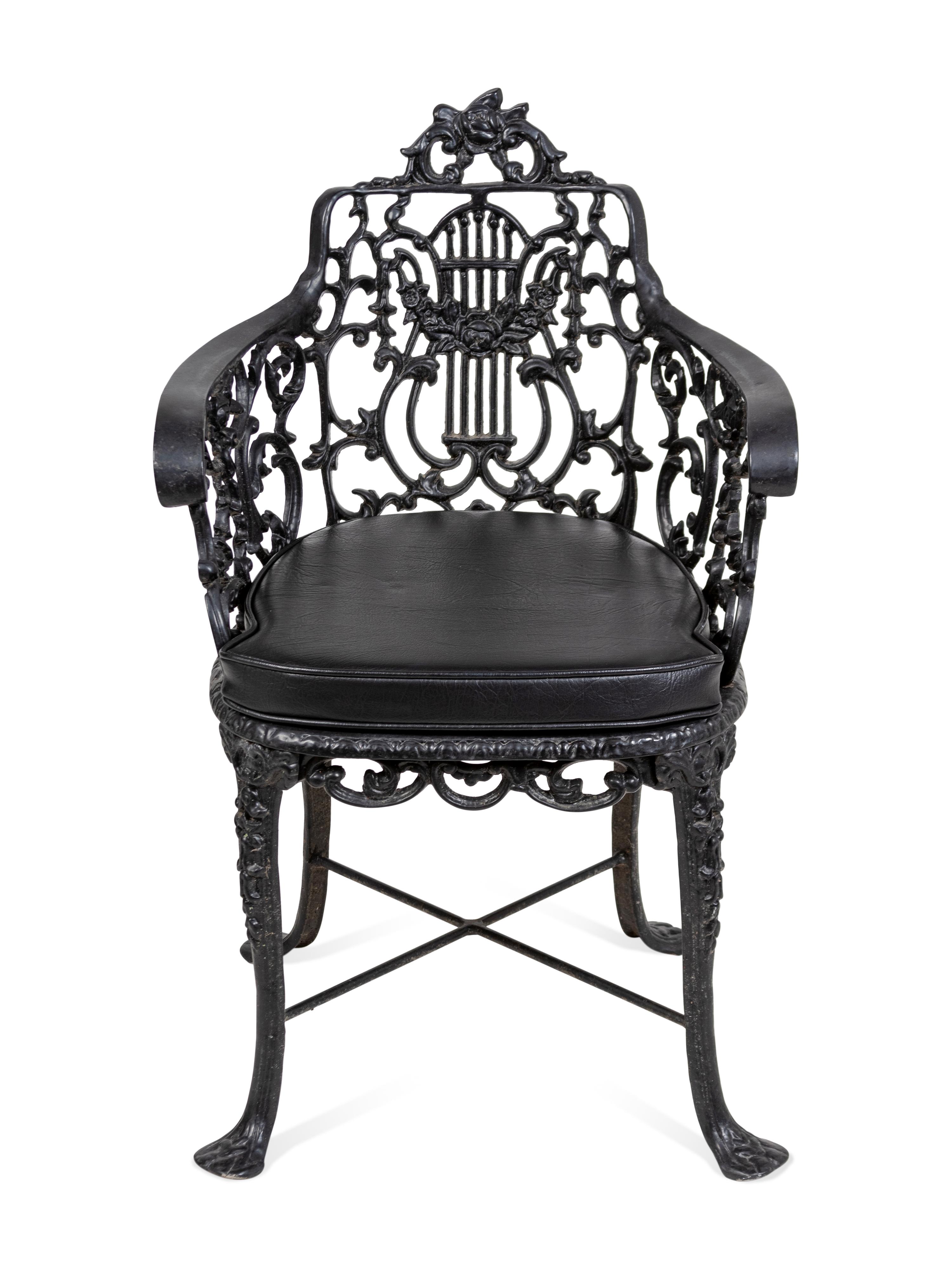 A Suite of Black Painted Metal Garden Furniture
